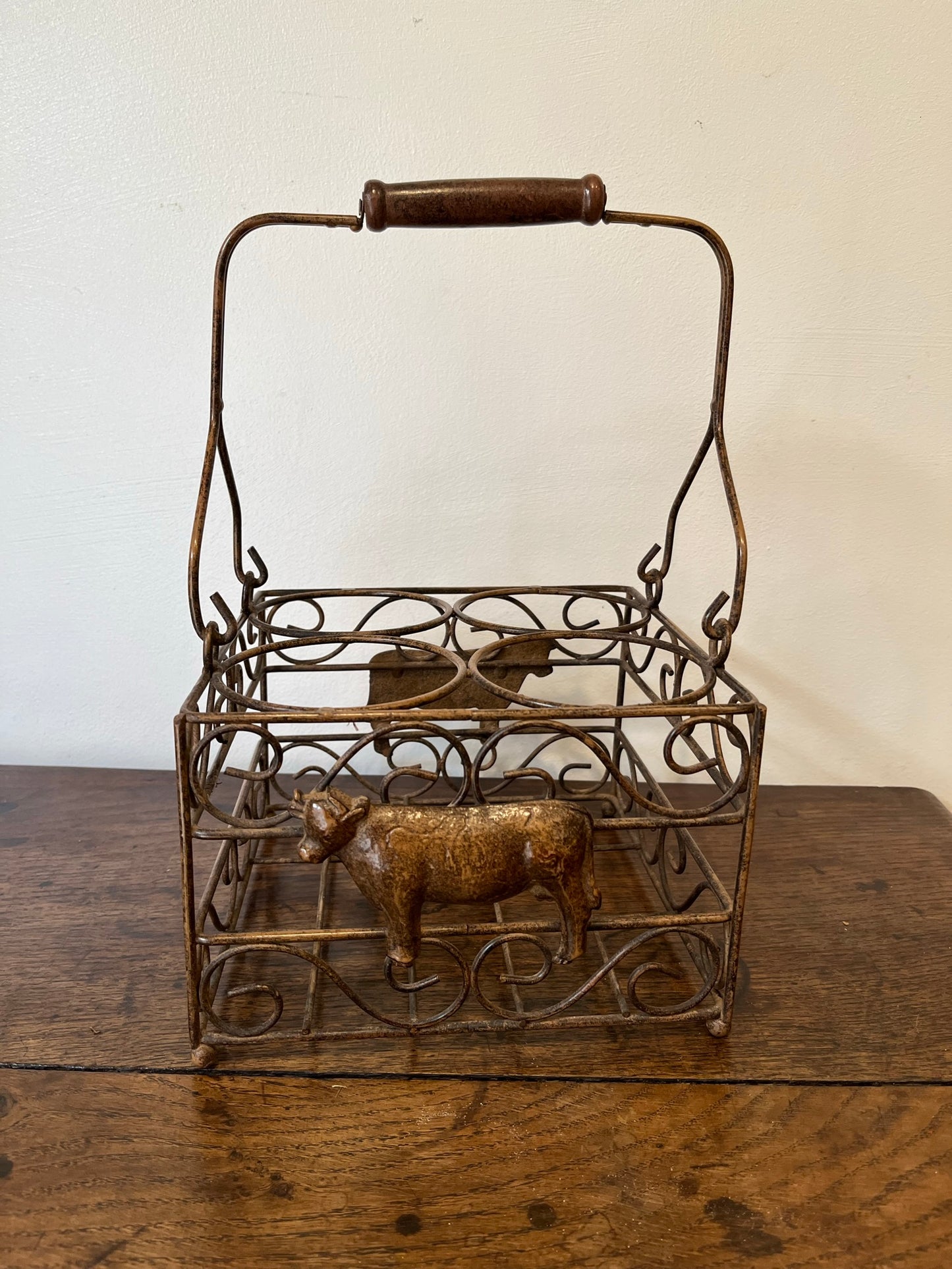 Pretty French milk bottle holder with cast cow detail.