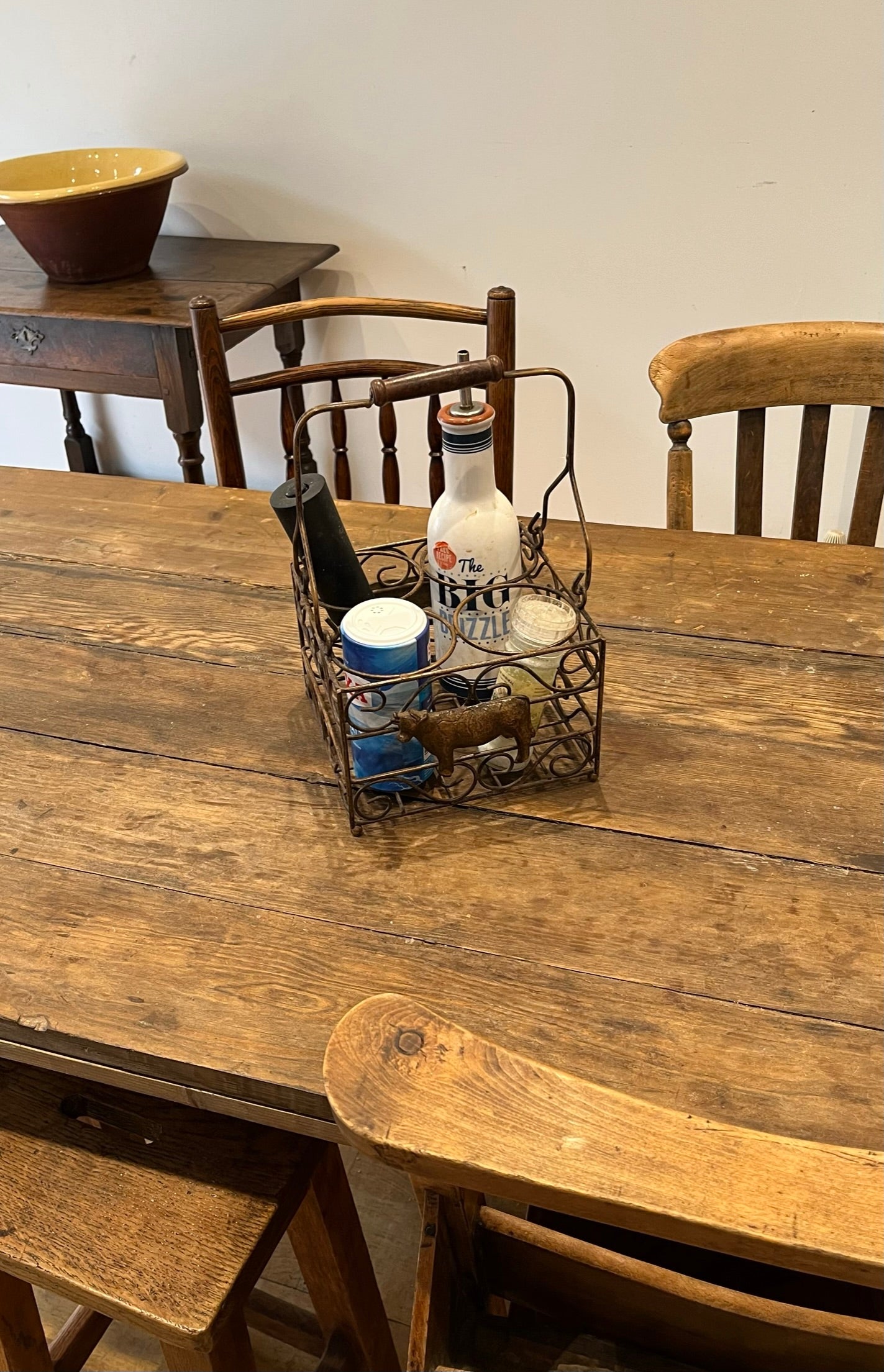 Pretty French milk bottle holder with cast cow detail.