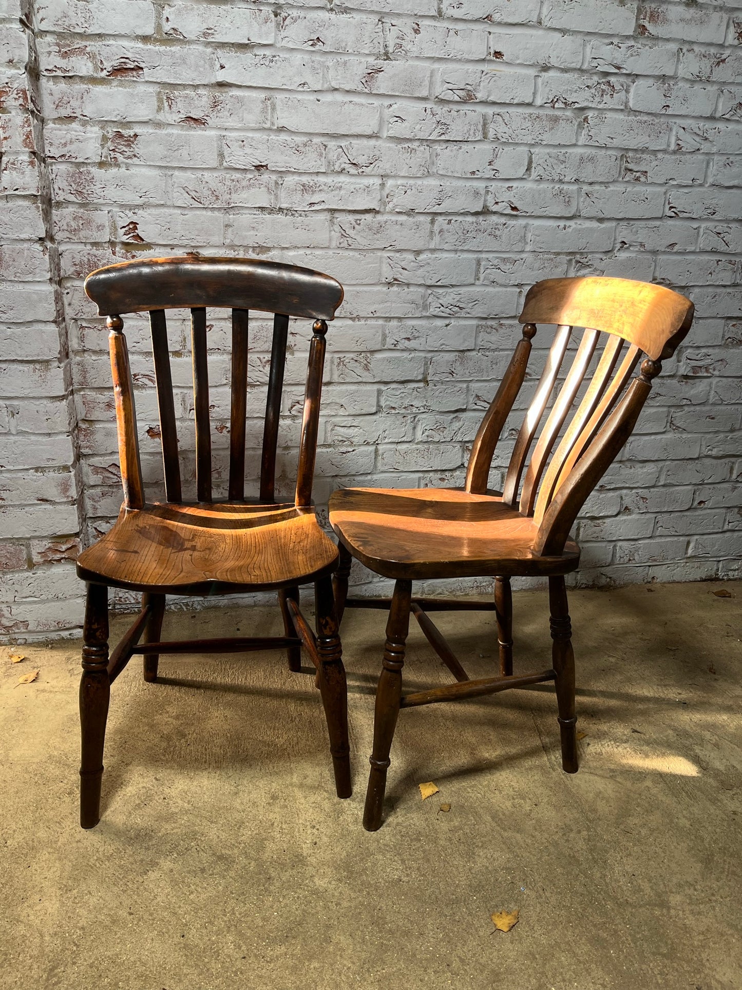 Near pair of Victorian elm slat back Windsor kitchen chairs.