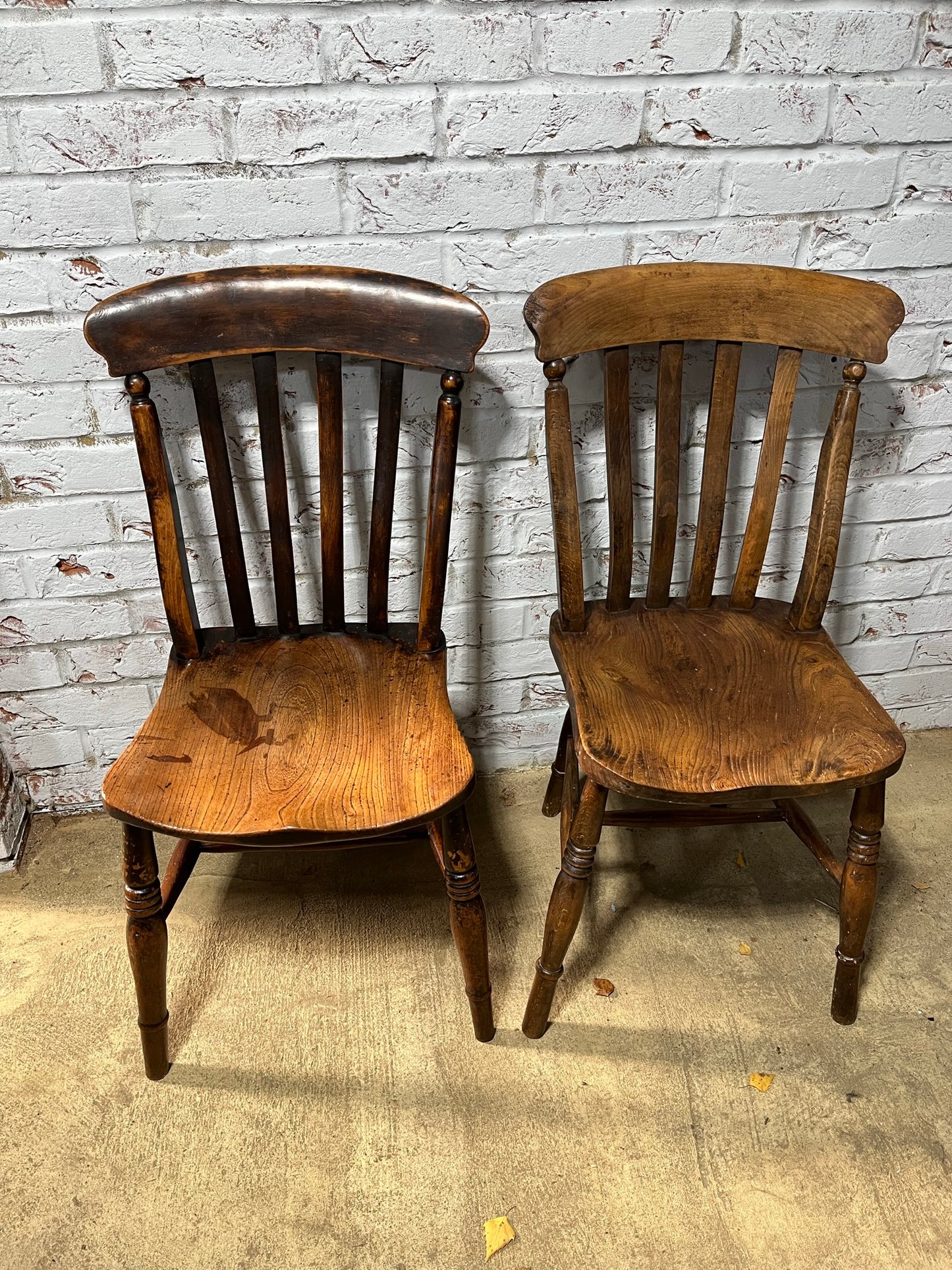 Near pair of Victorian elm slat back Windsor kitchen chairs.