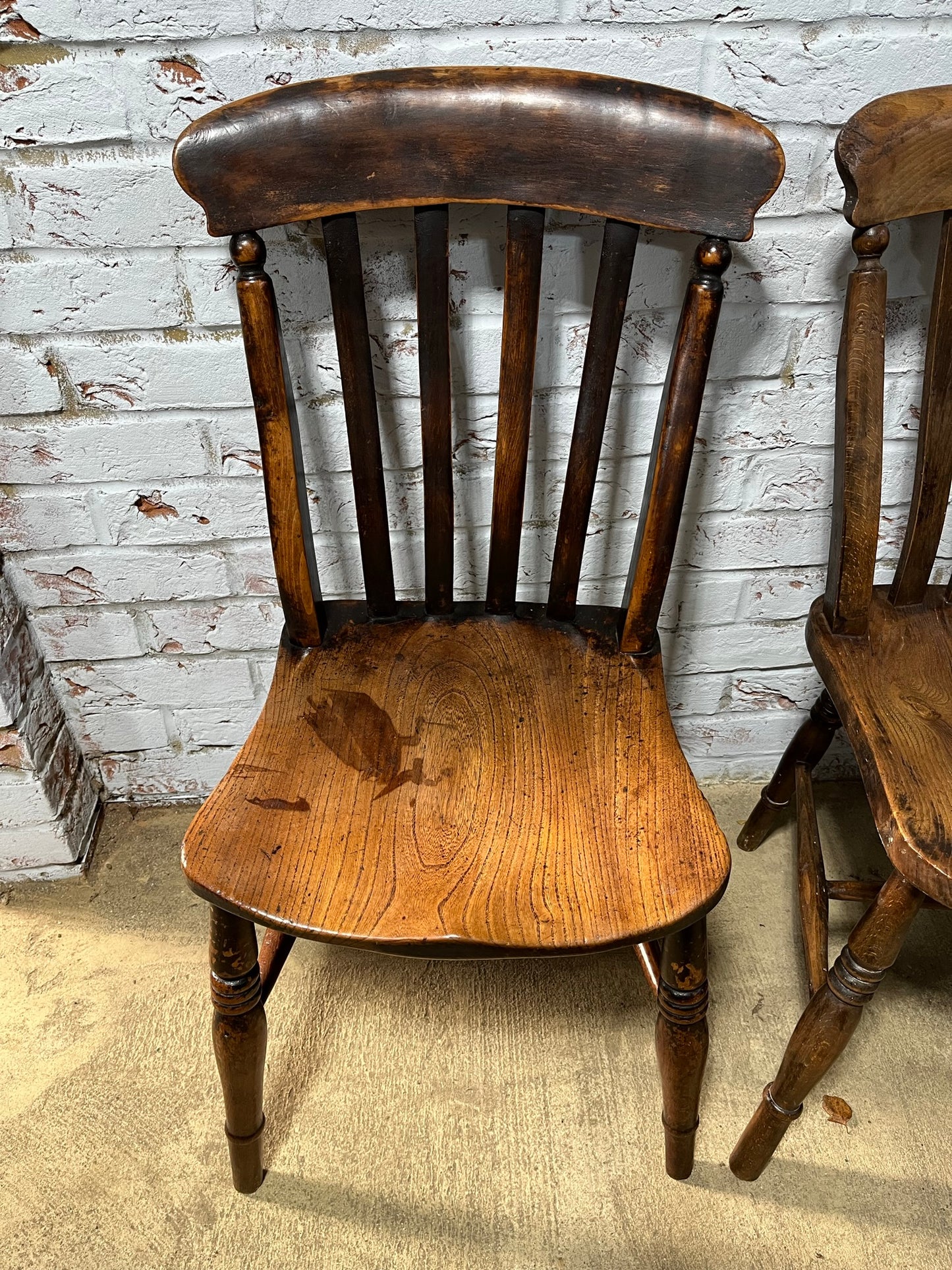 Near pair of Victorian elm slat back Windsor kitchen chairs.