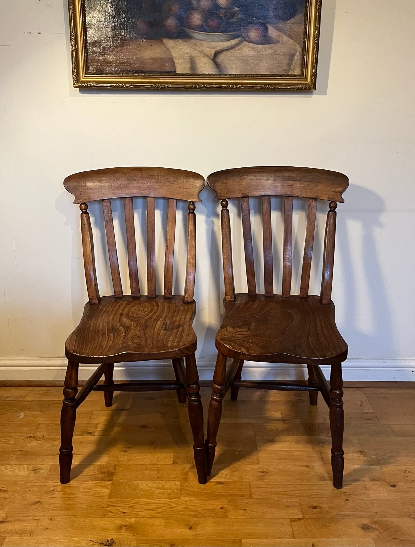 A good pair of Windsor slat back country kitchen chairs.