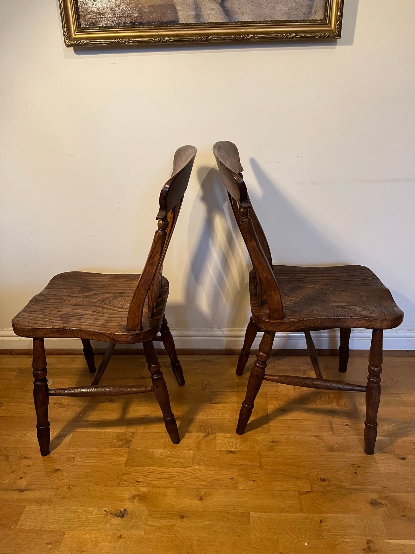 A good pair of Windsor slat back country kitchen chairs.