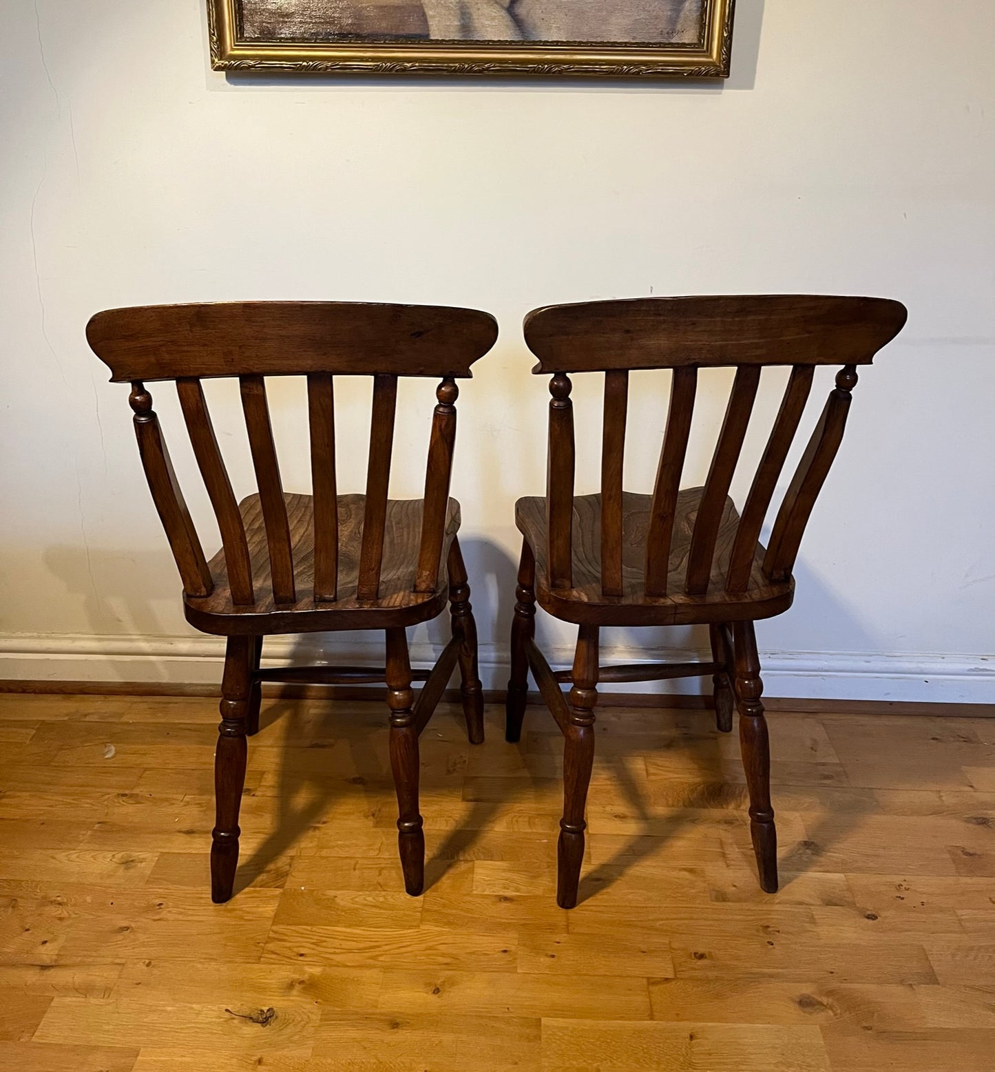 A good pair of Windsor slat back country kitchen chairs.