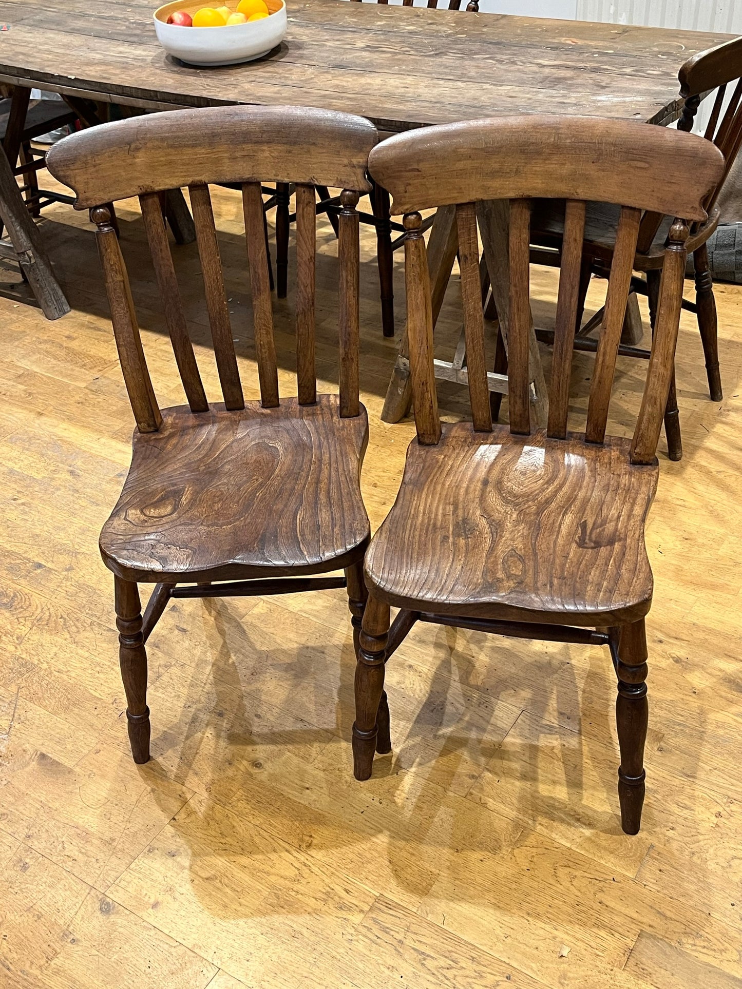 A good pair of Windsor slat back country kitchen chairs.