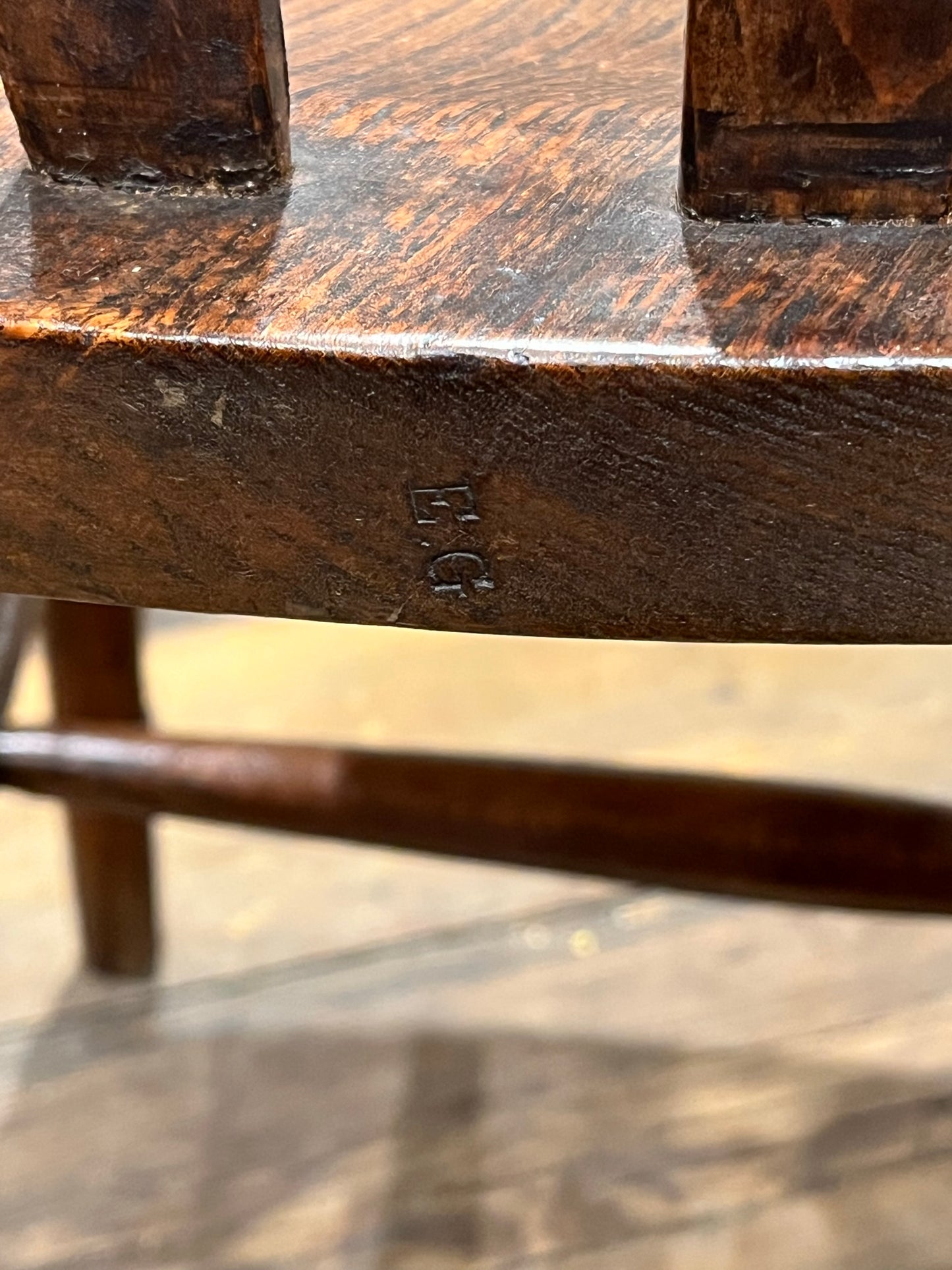 A pair of elm Windsor slat back country kitchen chairs.