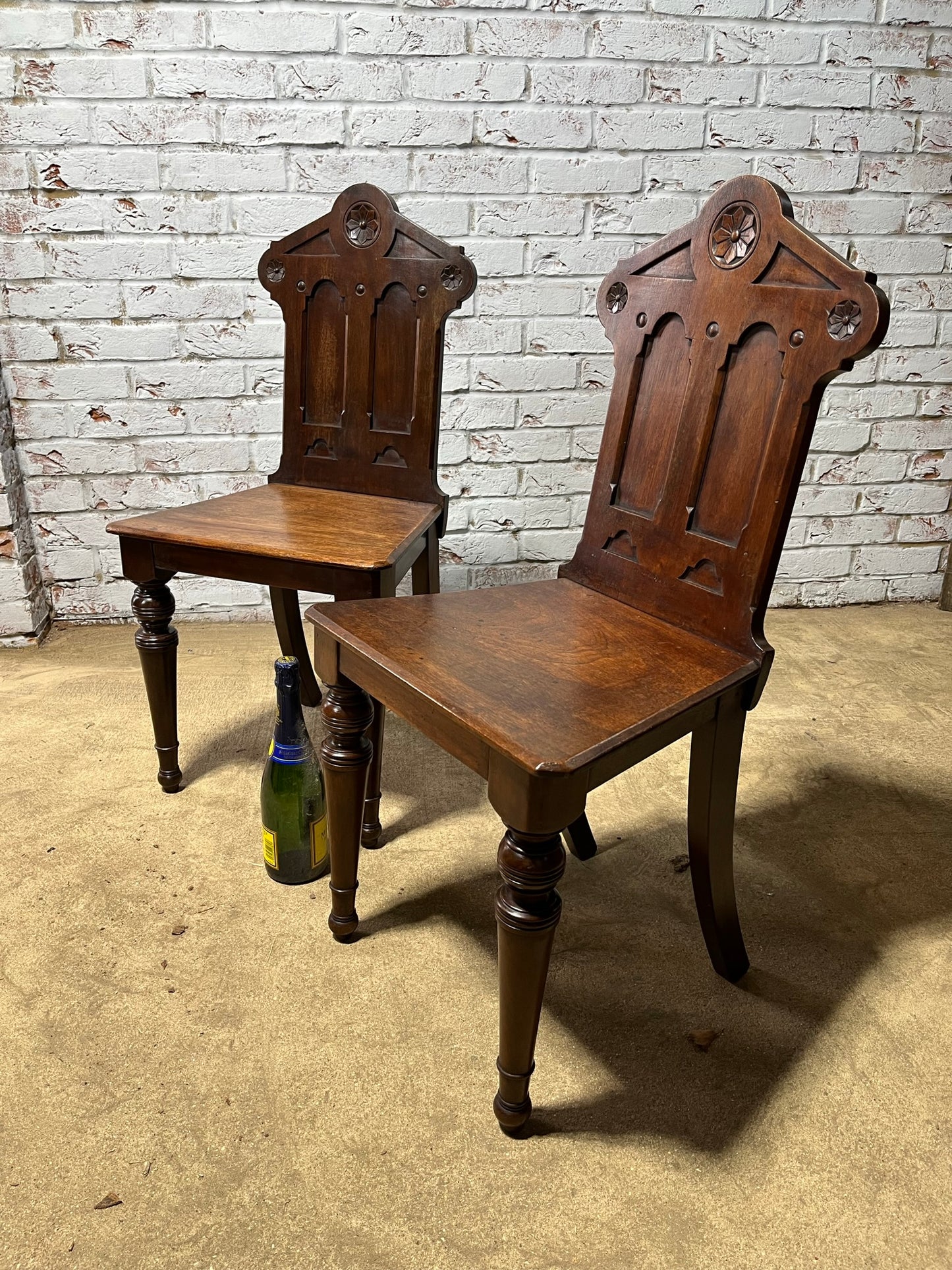 A pair of Gothic hall chairs.