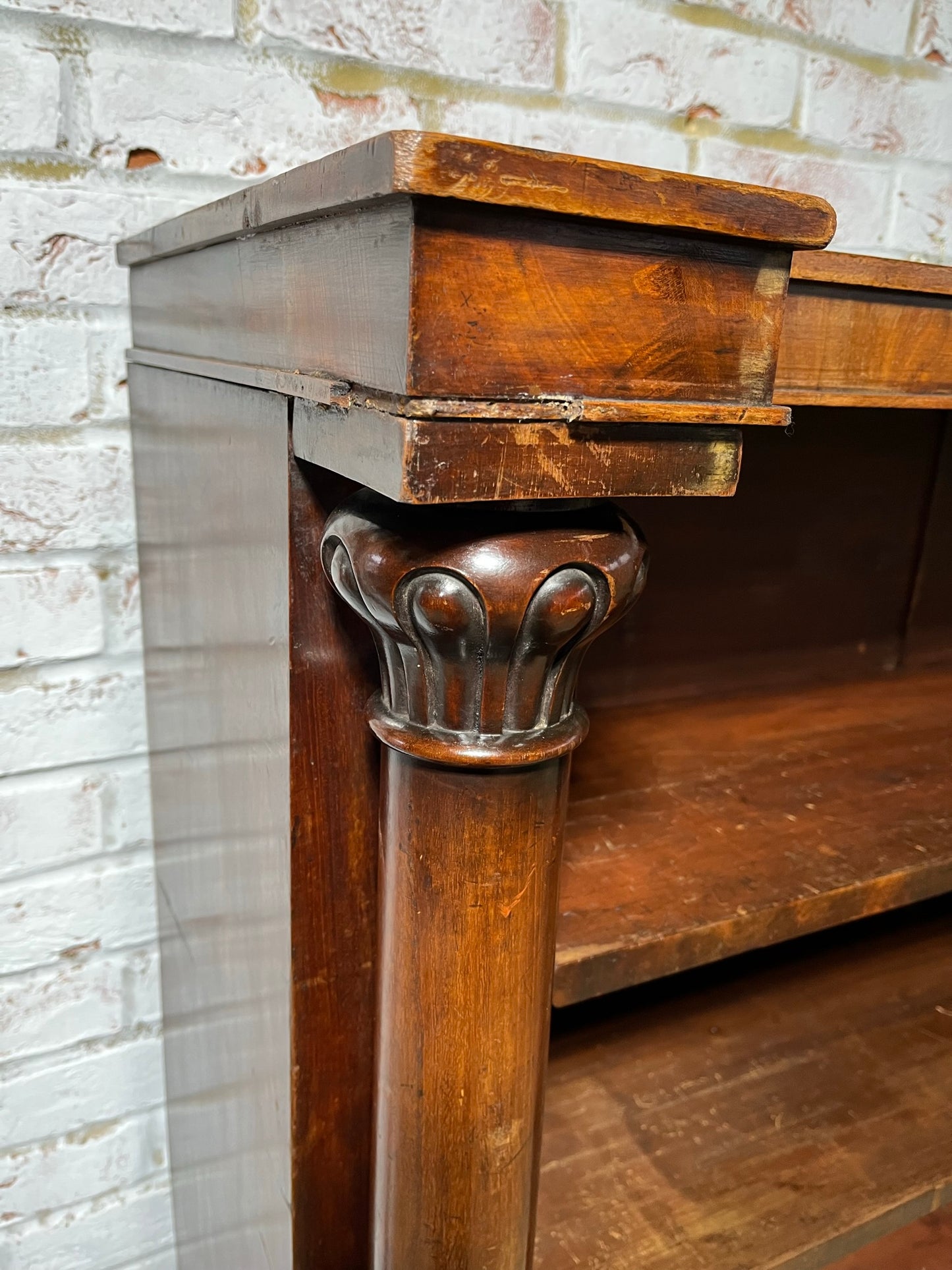 A very large William IV/early Victorian mahogany open bookcase with drawers.