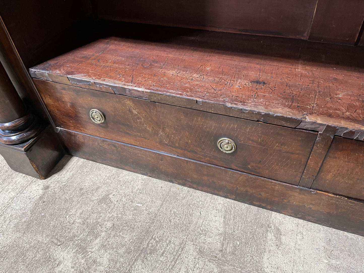 A very large William IV/early Victorian mahogany open bookcase with drawers.