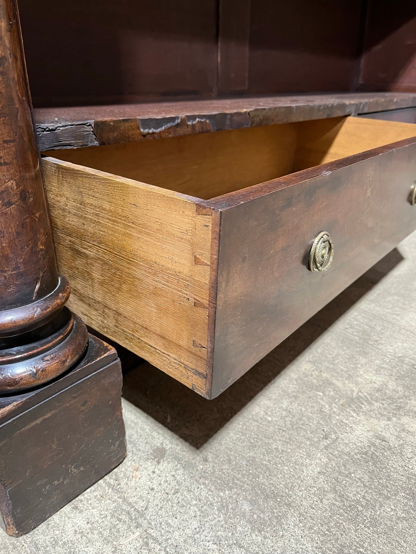 A very large William IV/early Victorian mahogany open bookcase with drawers.