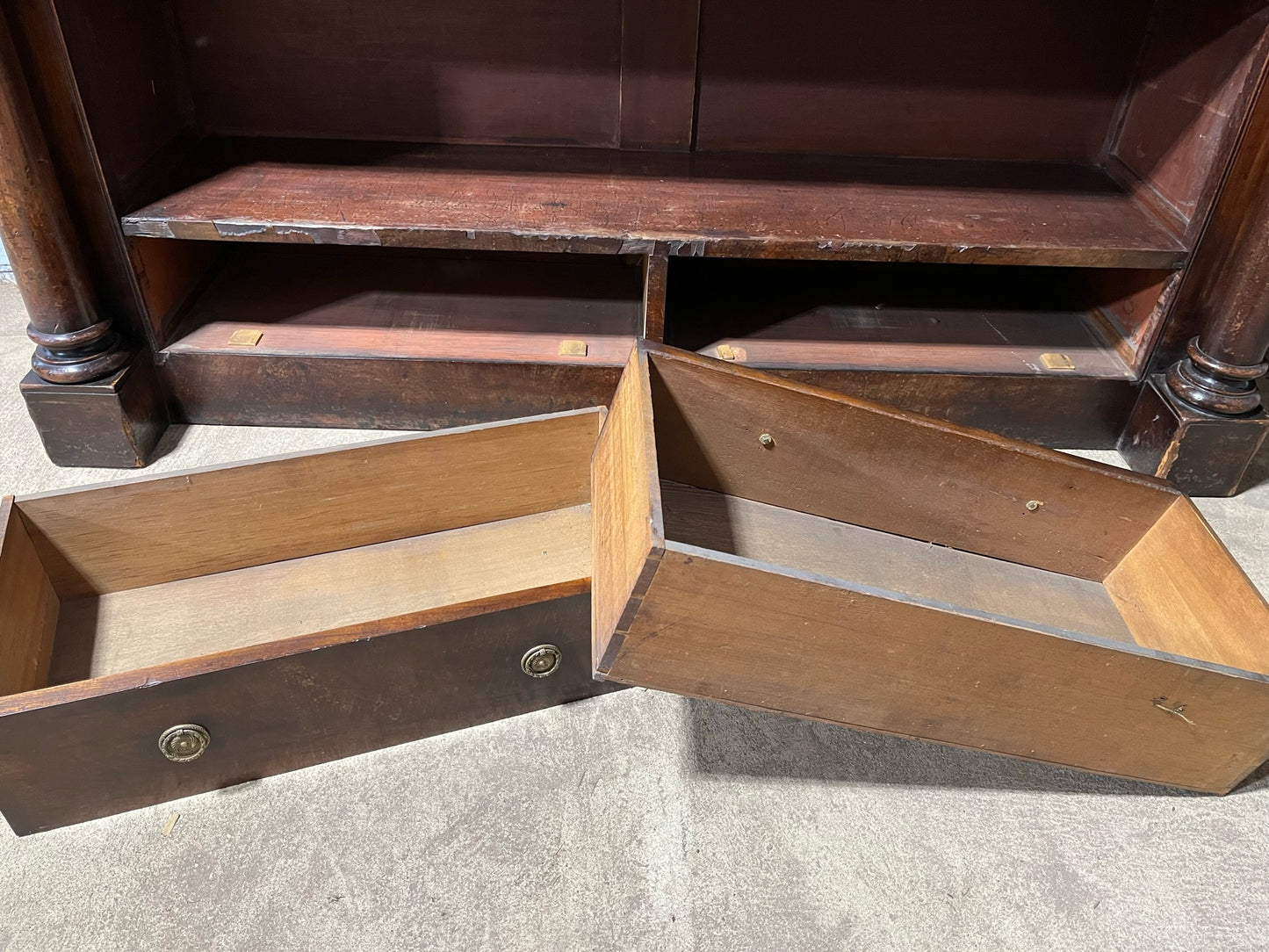 A very large William IV/early Victorian mahogany open bookcase with drawers.