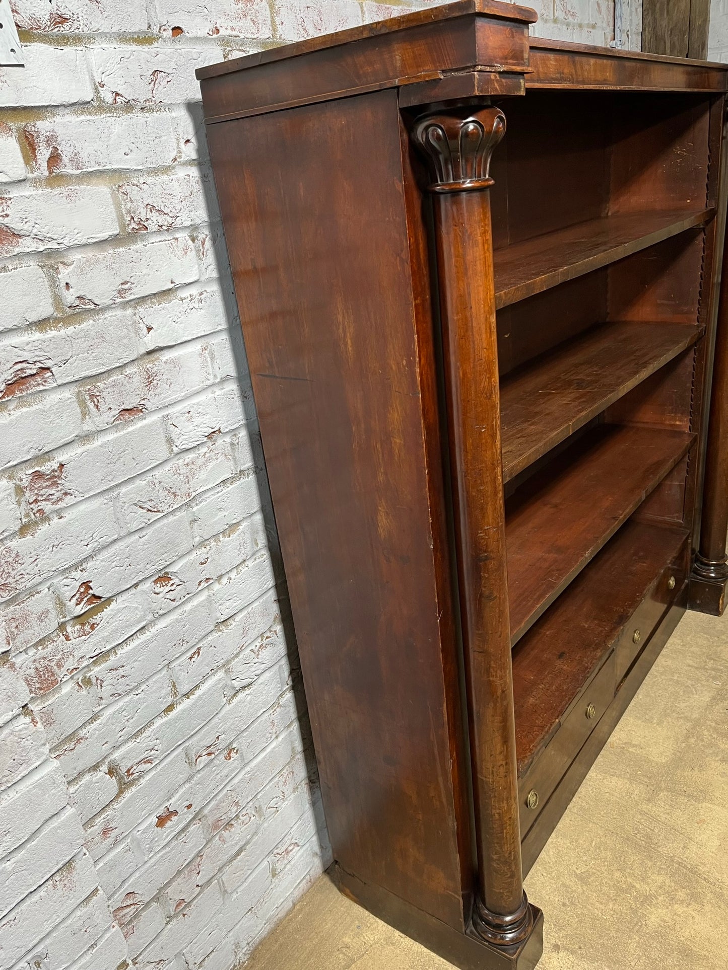 A very large William IV/early Victorian mahogany open bookcase with drawers.