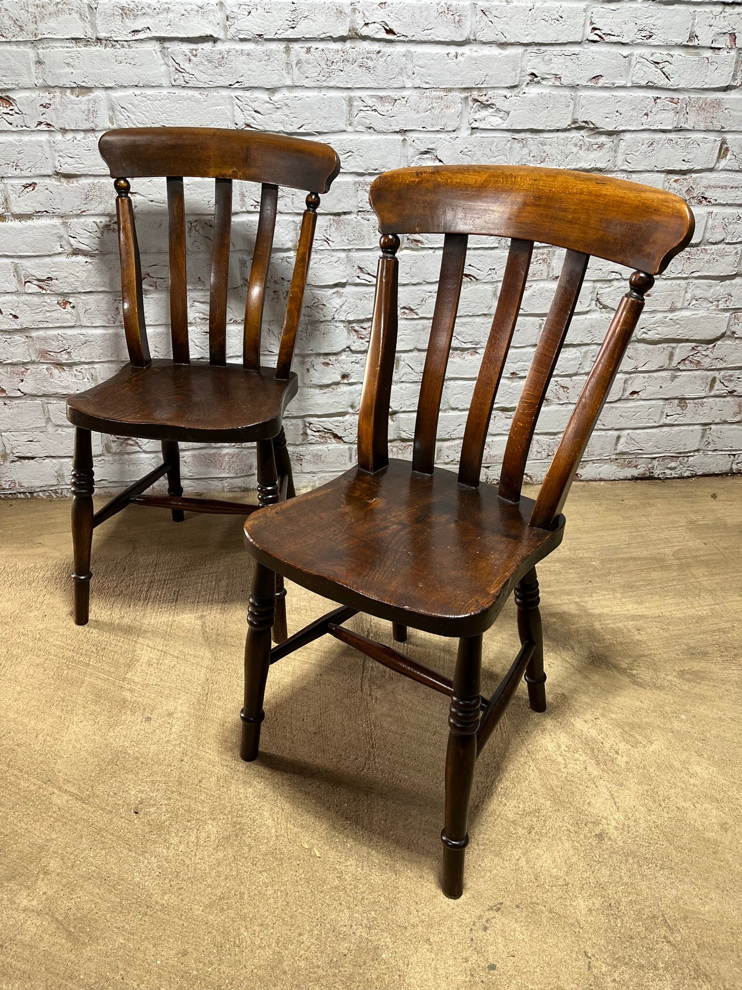 Matching pair of early 19th century kitchen Windsor chairs.