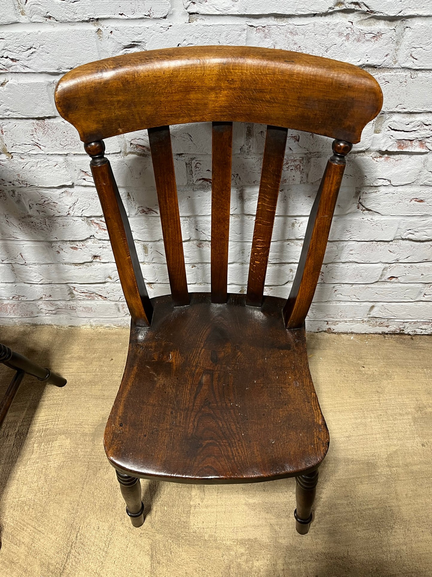 Matching pair of early 19th century kitchen Windsor chairs.
