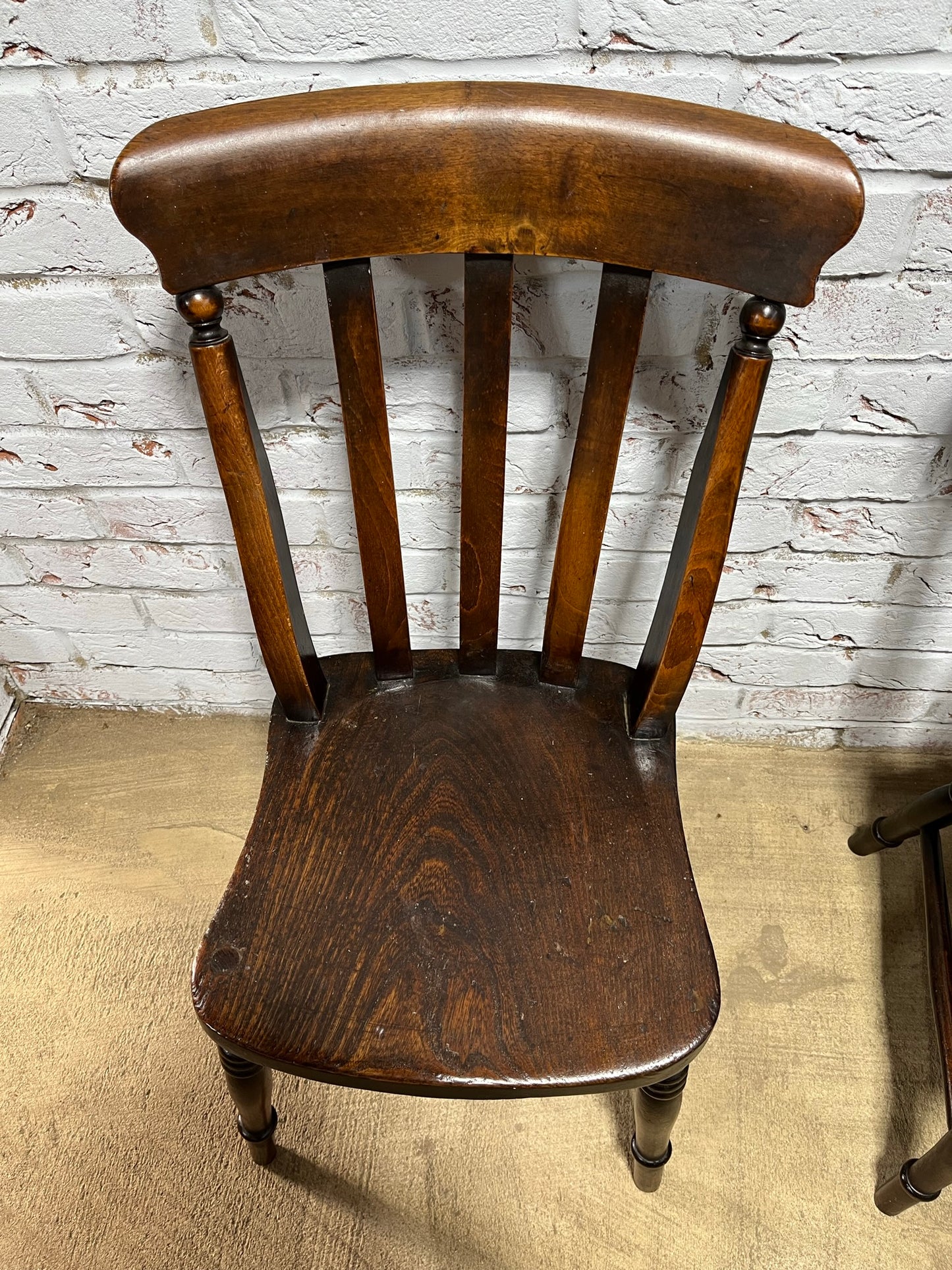 Matching pair of early 19th century kitchen Windsor chairs.