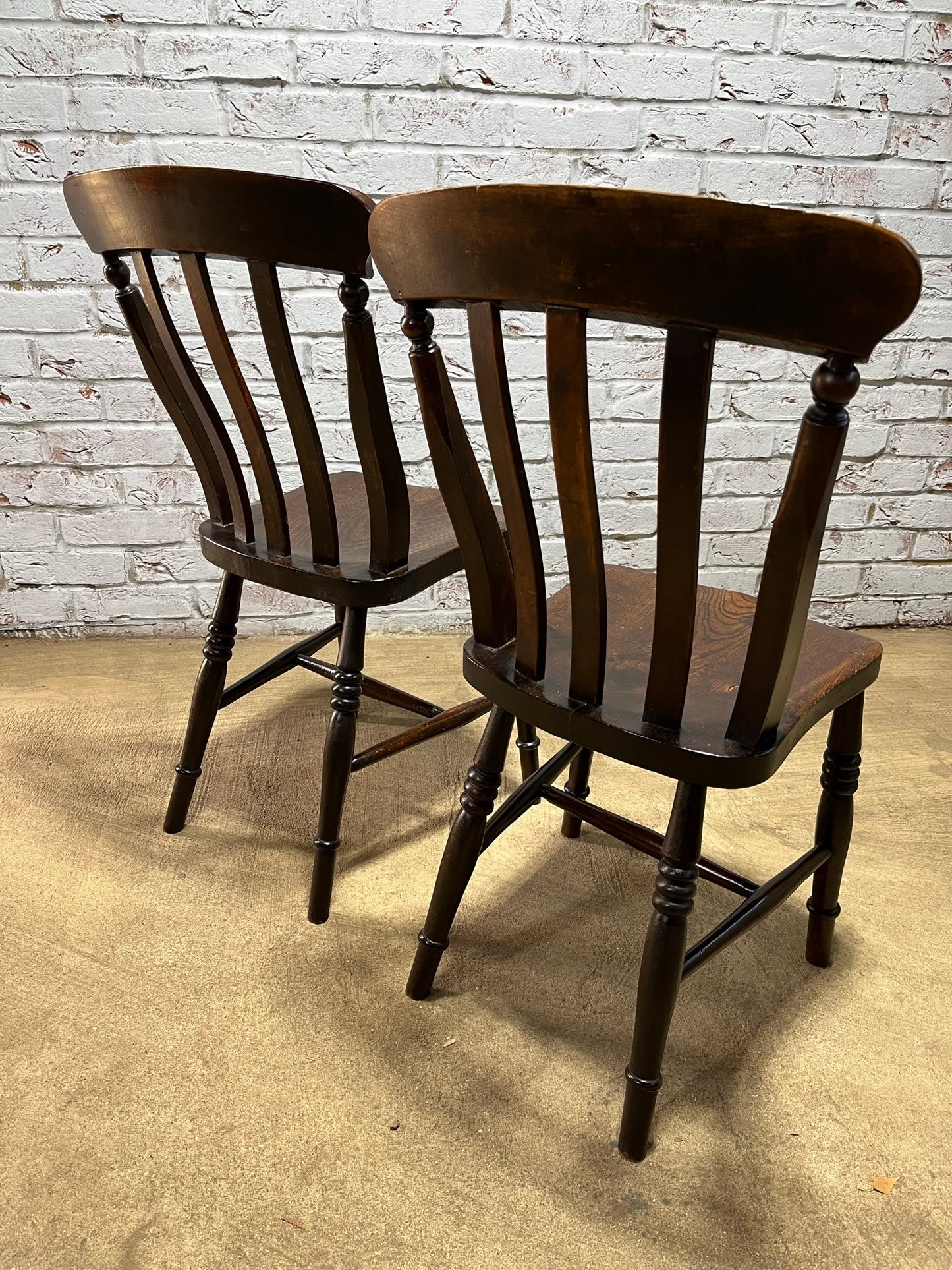 Matching pair of early 19th century kitchen Windsor chairs.