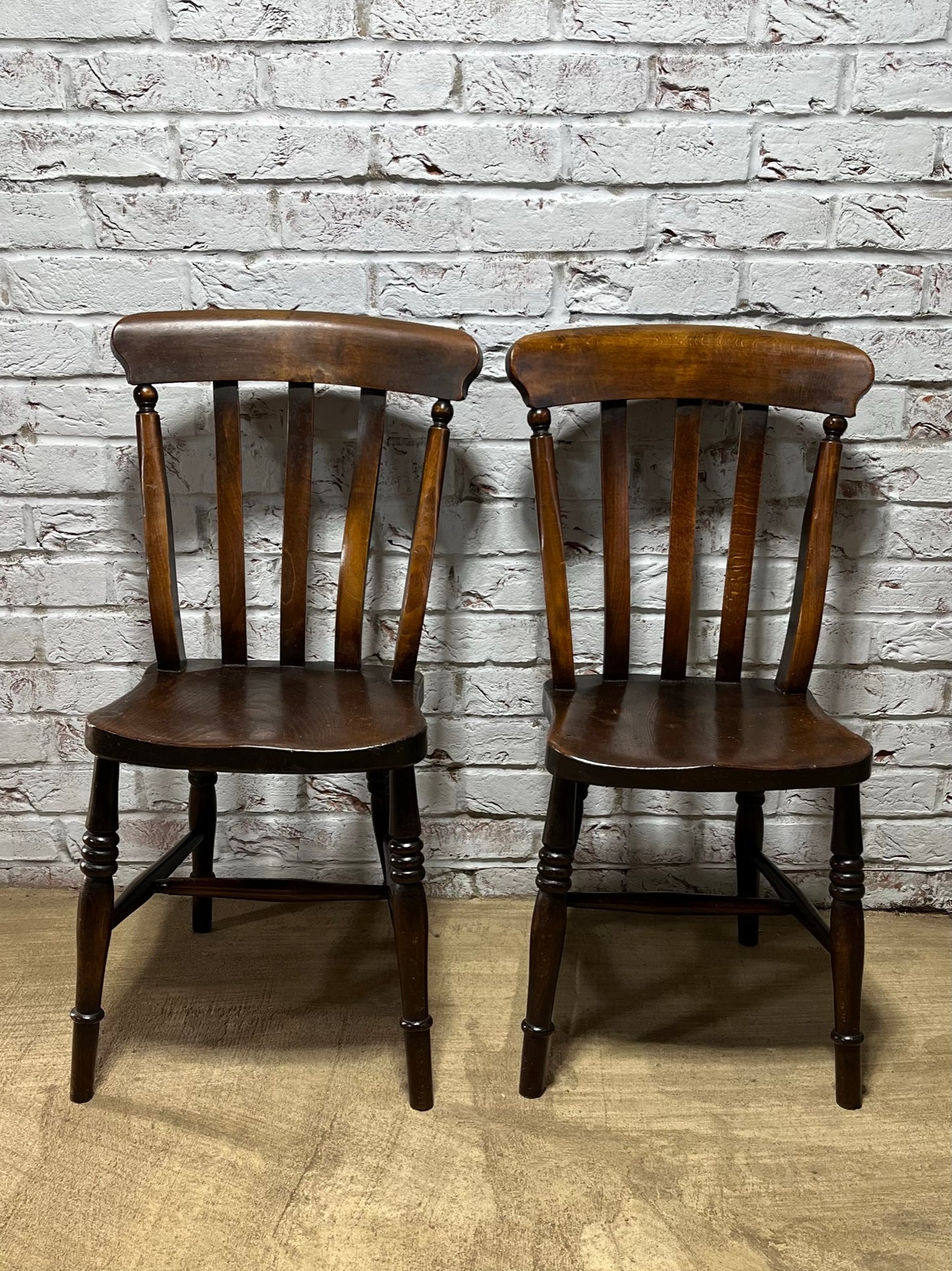 Matching pair of early 19th century kitchen Windsor chairs.