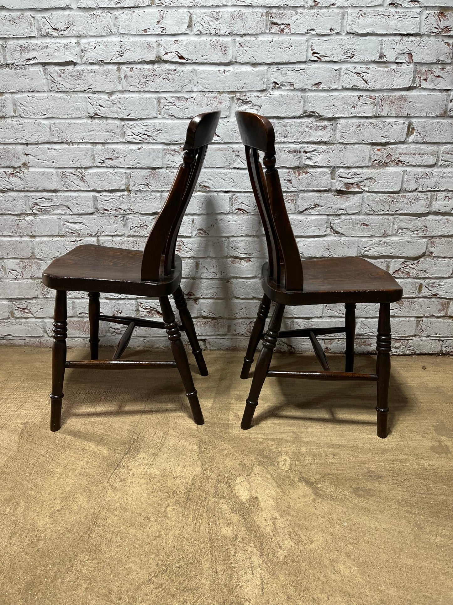 Matching pair of early 19th century kitchen Windsor chairs.