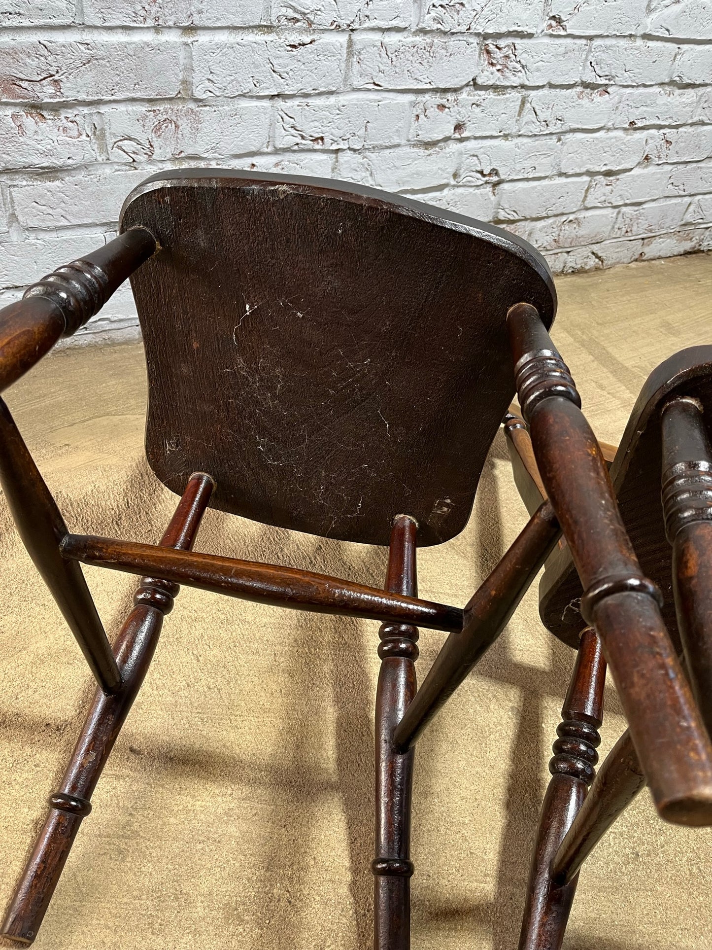Matching pair of early 19th century kitchen Windsor chairs.