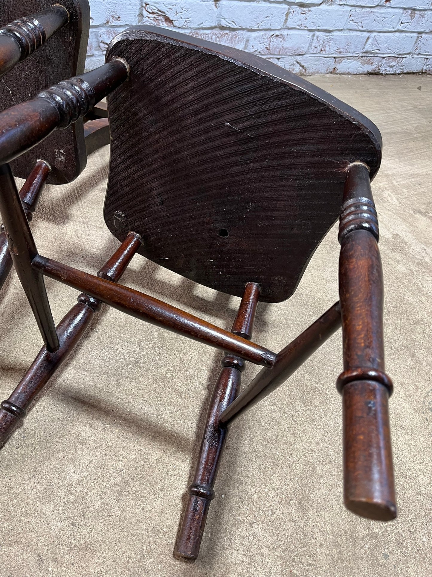 Matching pair of early 19th century kitchen Windsor chairs.