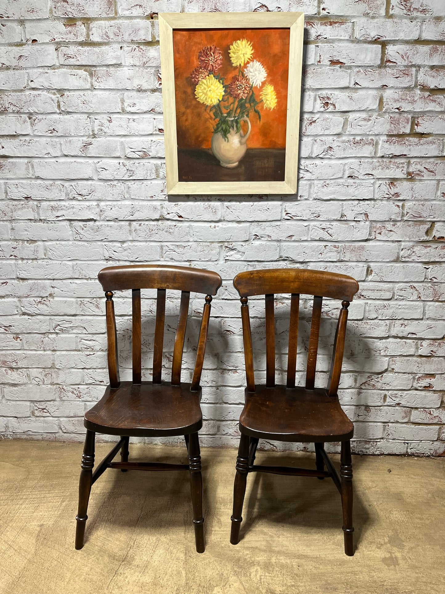 Matching pair of early 19th century kitchen Windsor chairs.