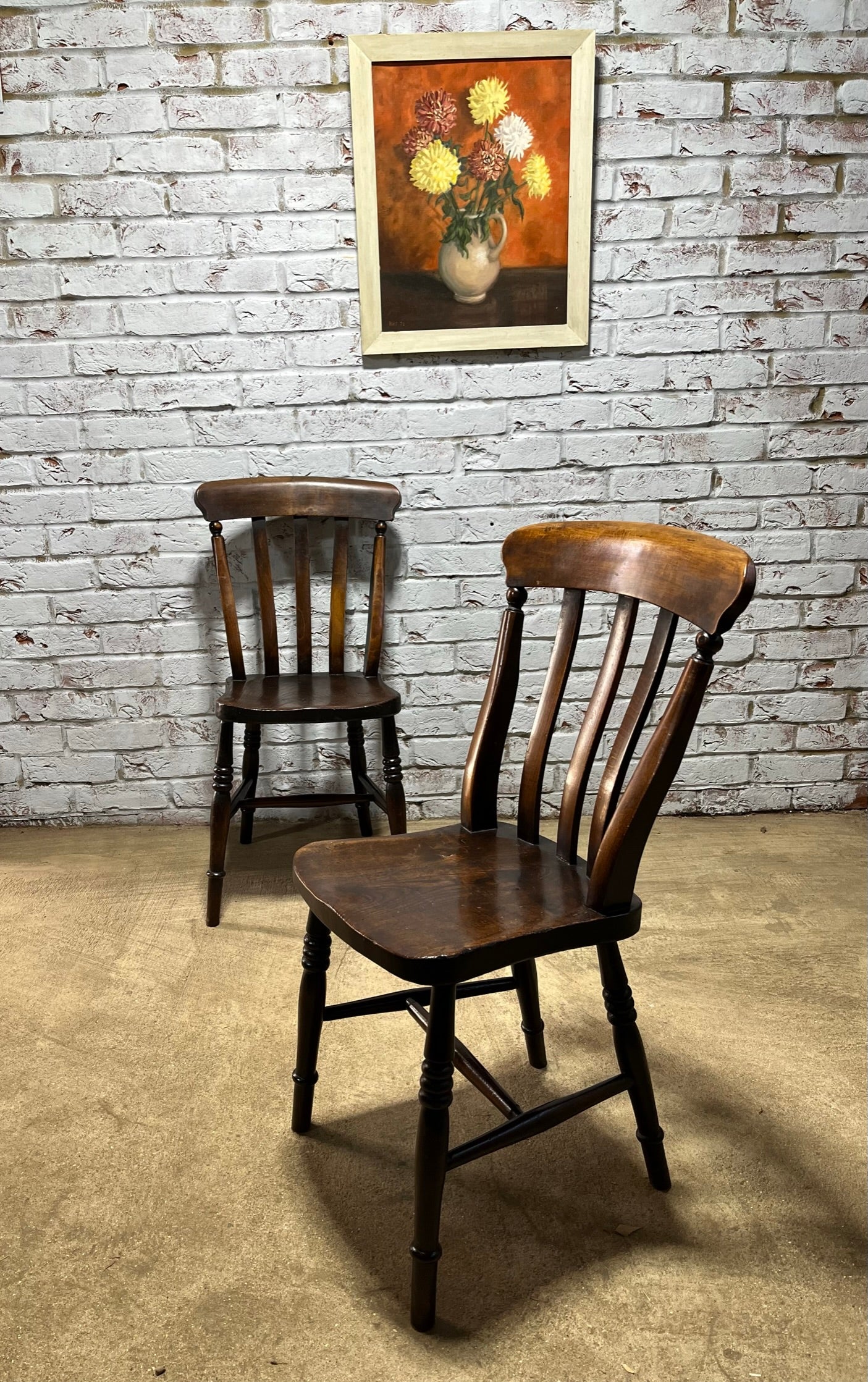 Matching pair of early 19th century kitchen Windsor chairs.