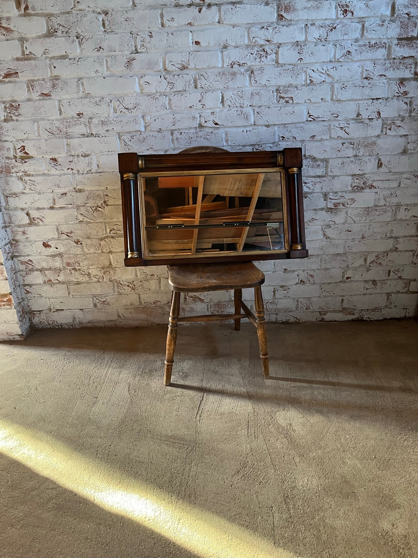 Regency rosewood and gilt overmantle or wall mirror.