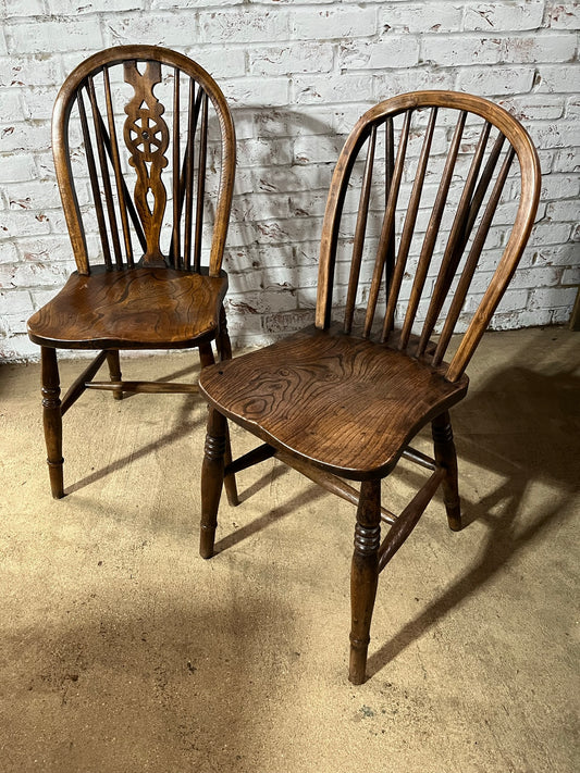 Two 19th century wheel back/stick back kitchen or dining chairs.