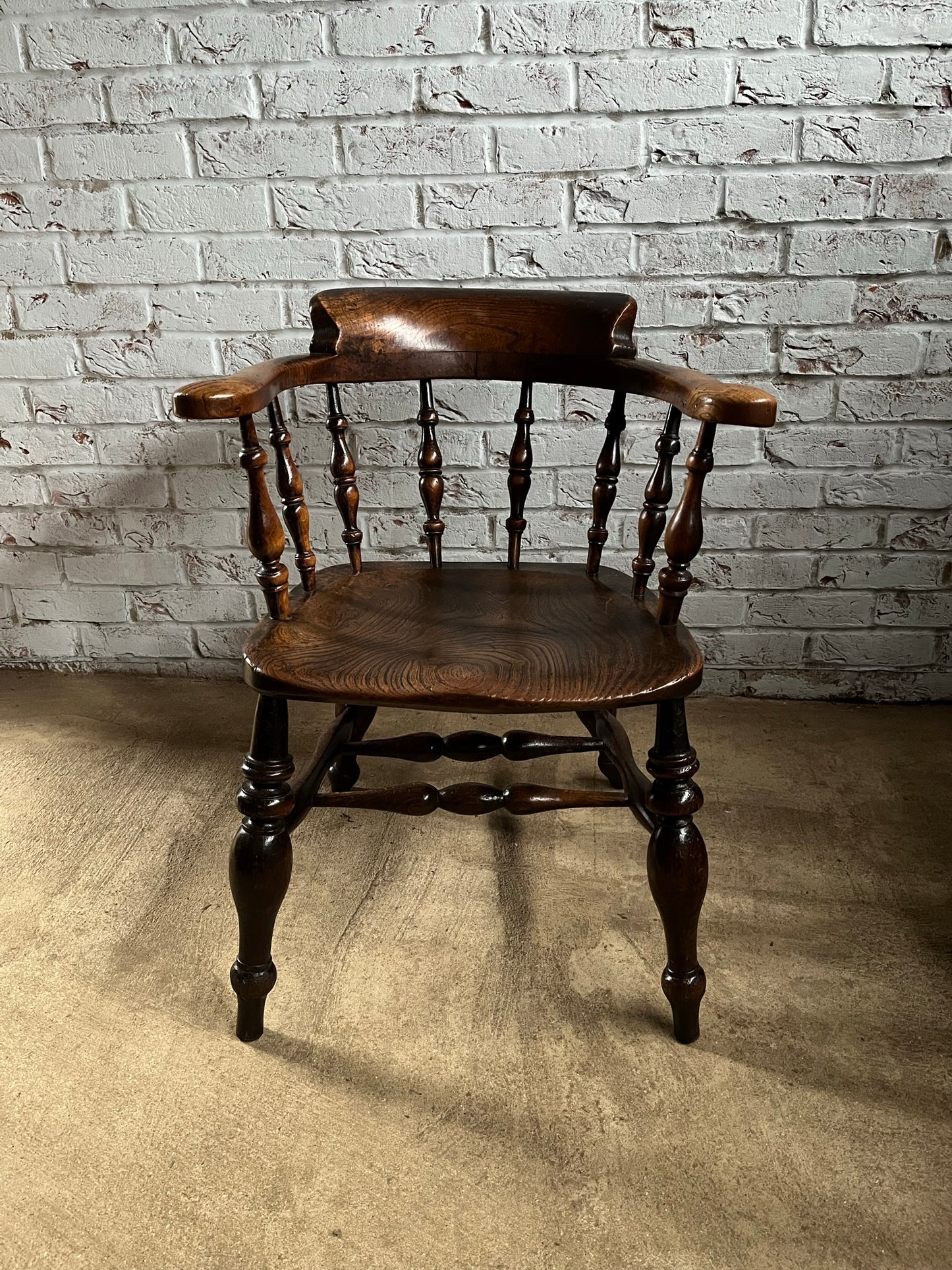 Early Victorian smokers bow arm fireside chair.