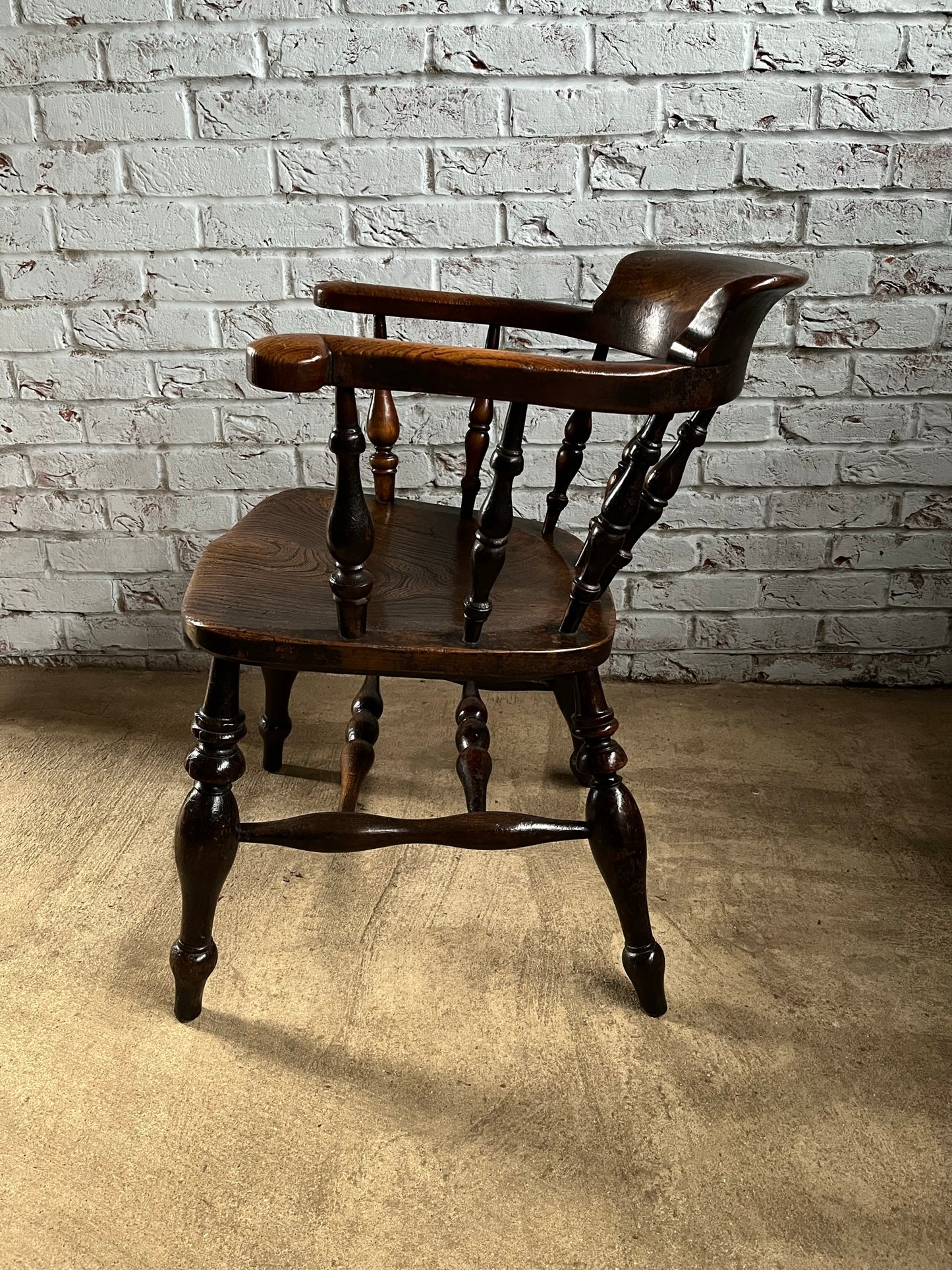 Early Victorian smokers bow arm fireside chair.