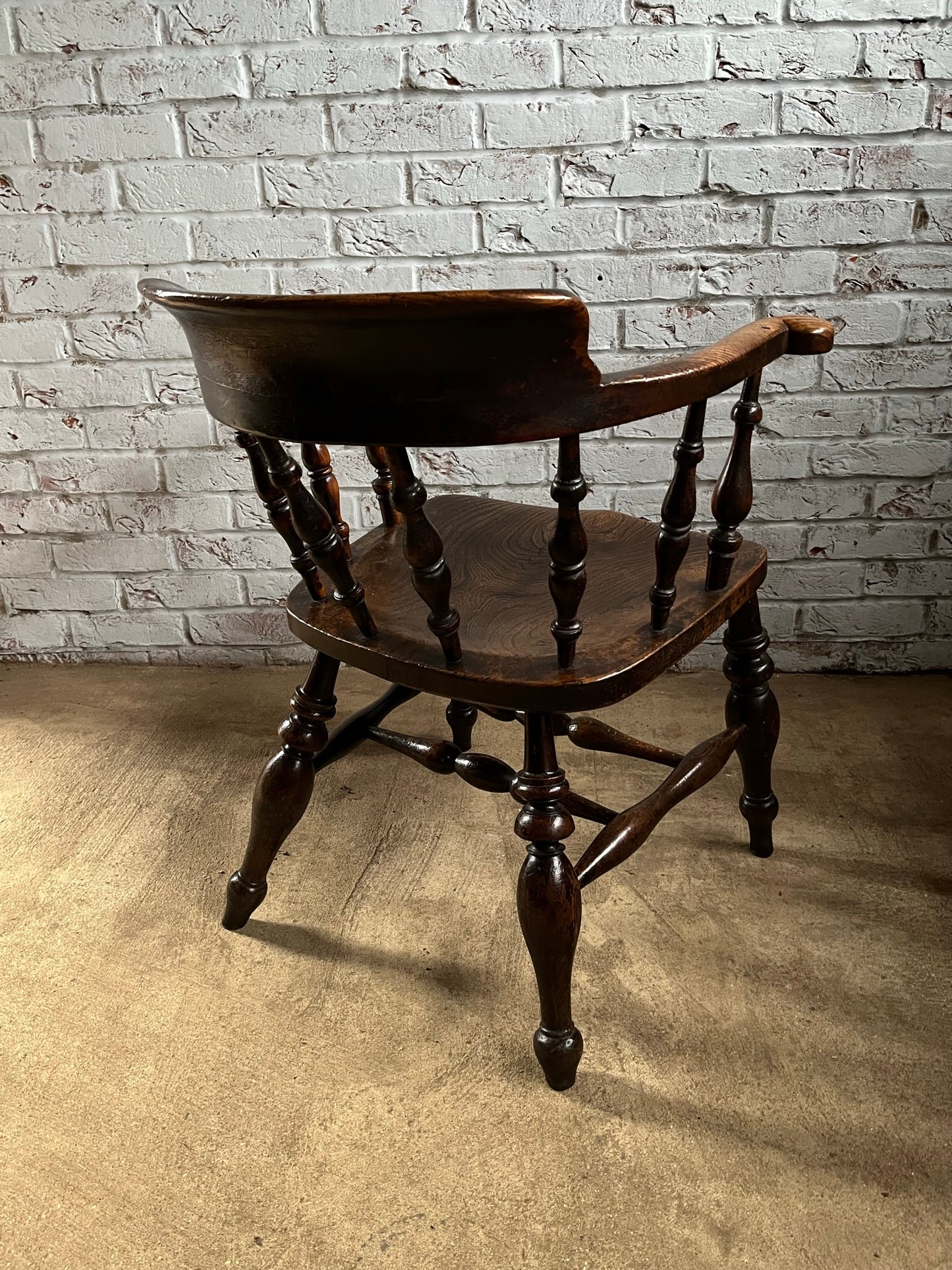 Early Victorian smokers bow arm fireside chair.