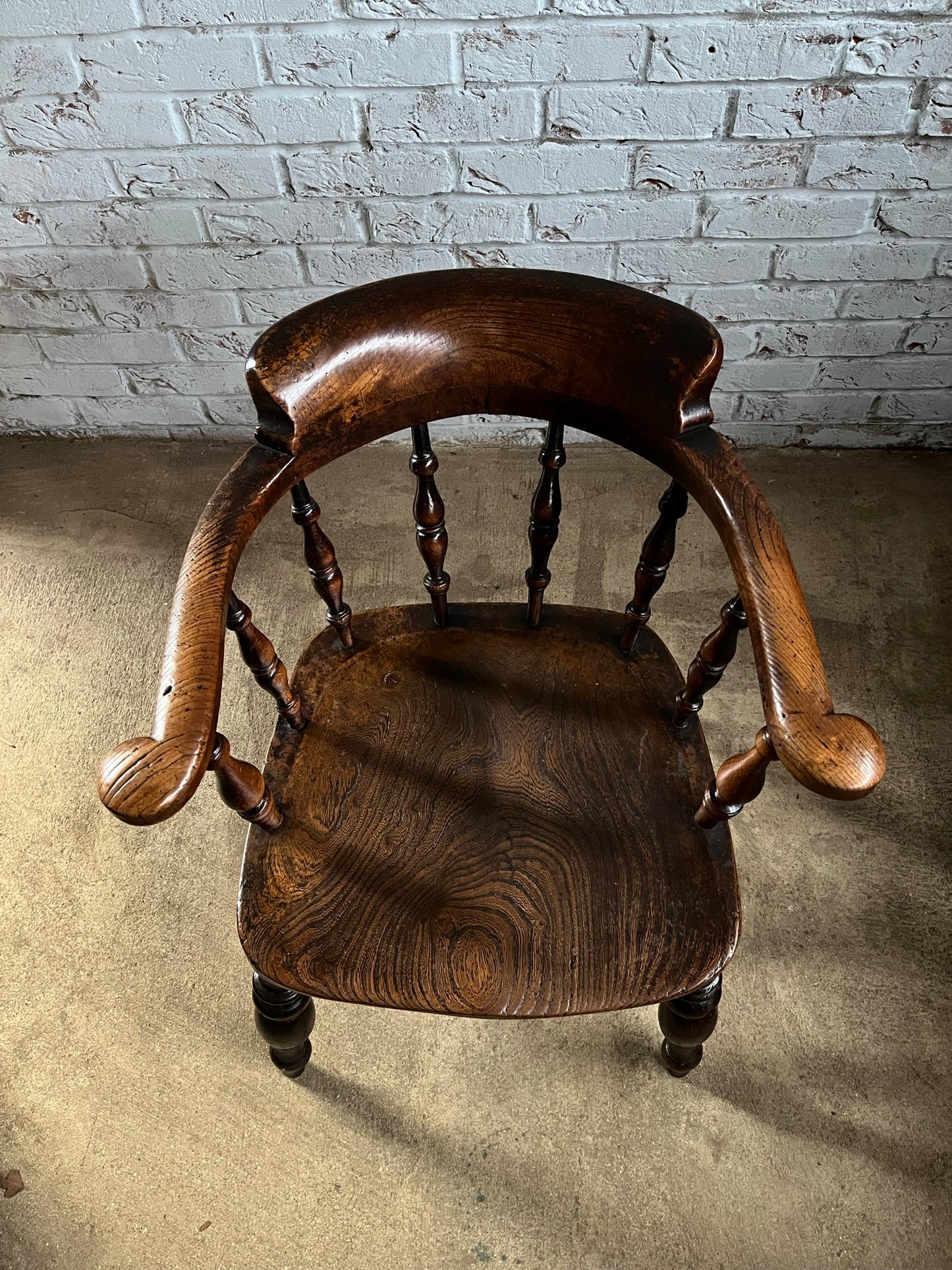 Early Victorian smokers bow arm fireside chair.