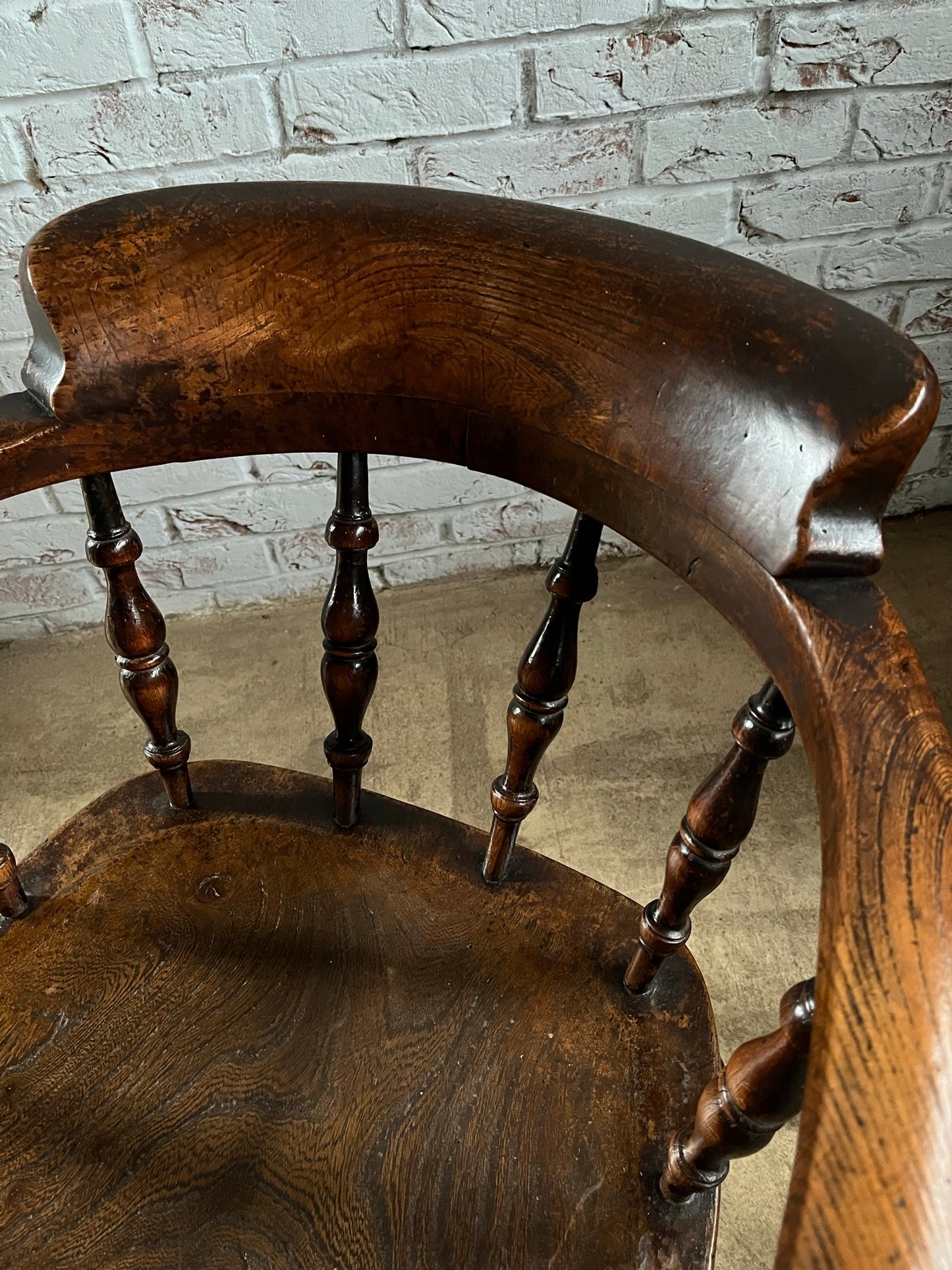Early Victorian smokers bow arm fireside chair.