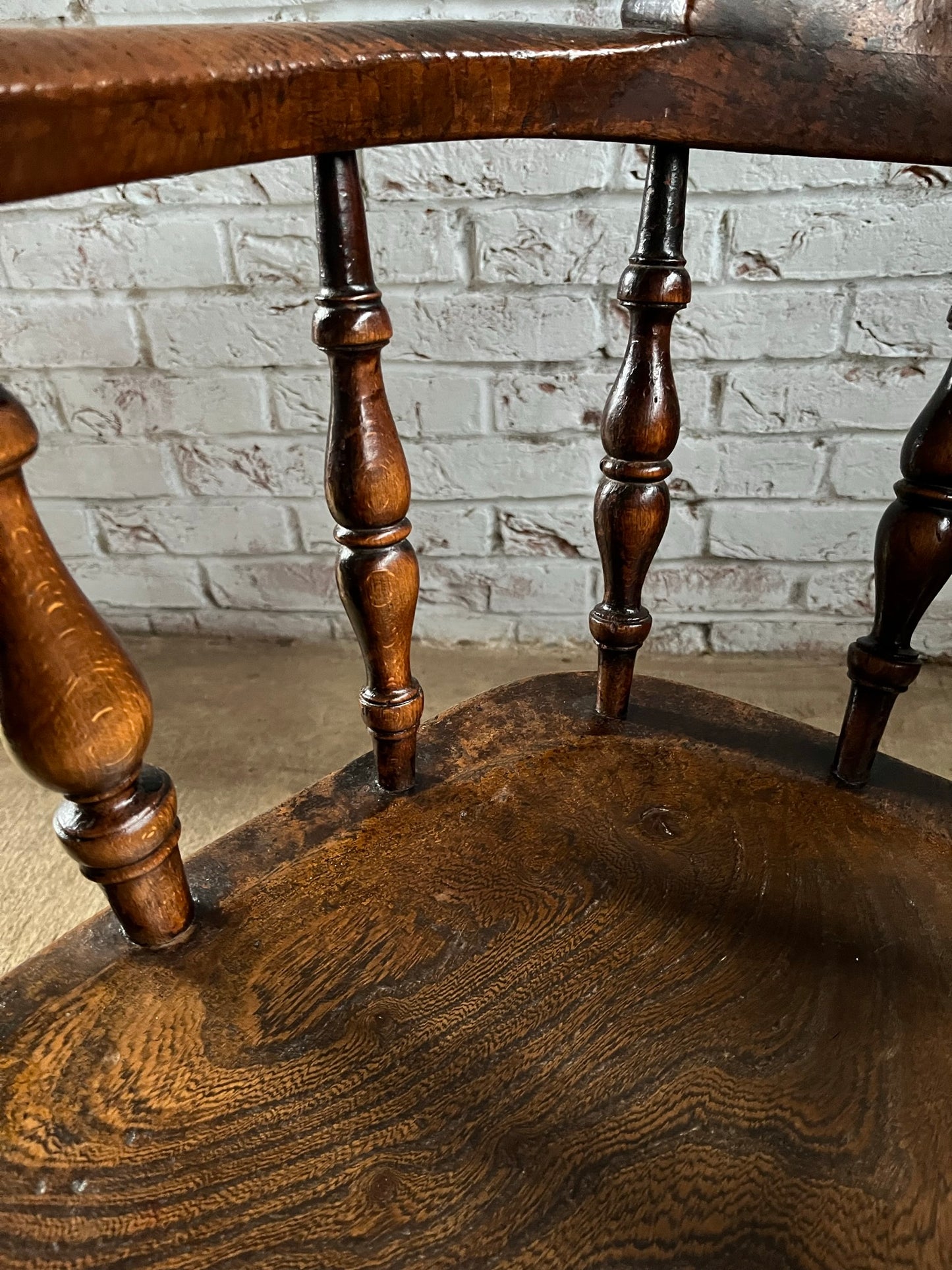 Early Victorian smokers bow arm fireside chair.