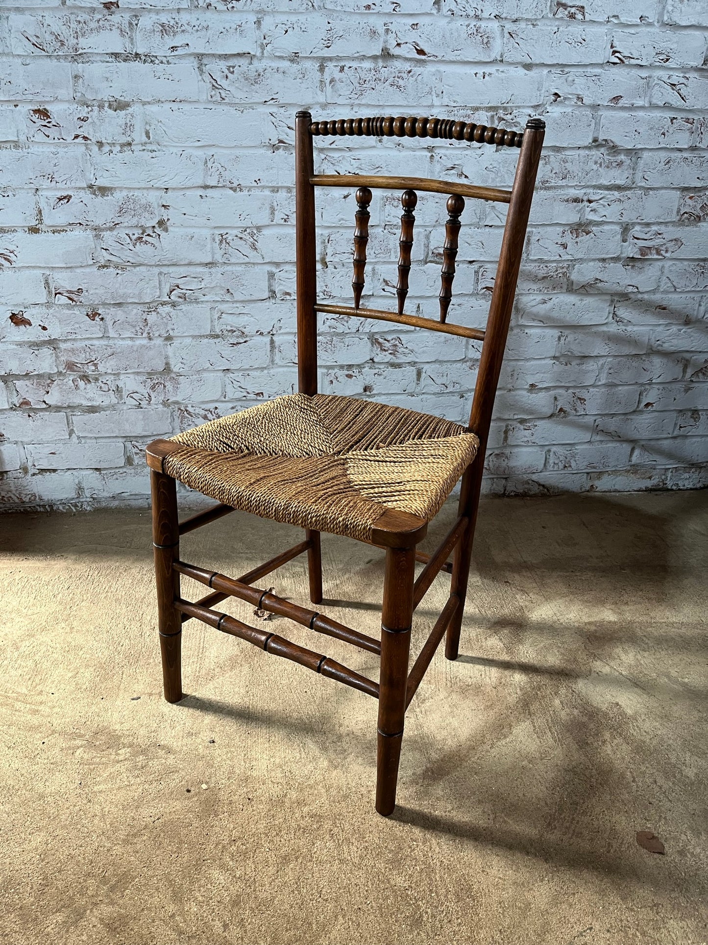 Antique spindle and bobbin back country side chair.