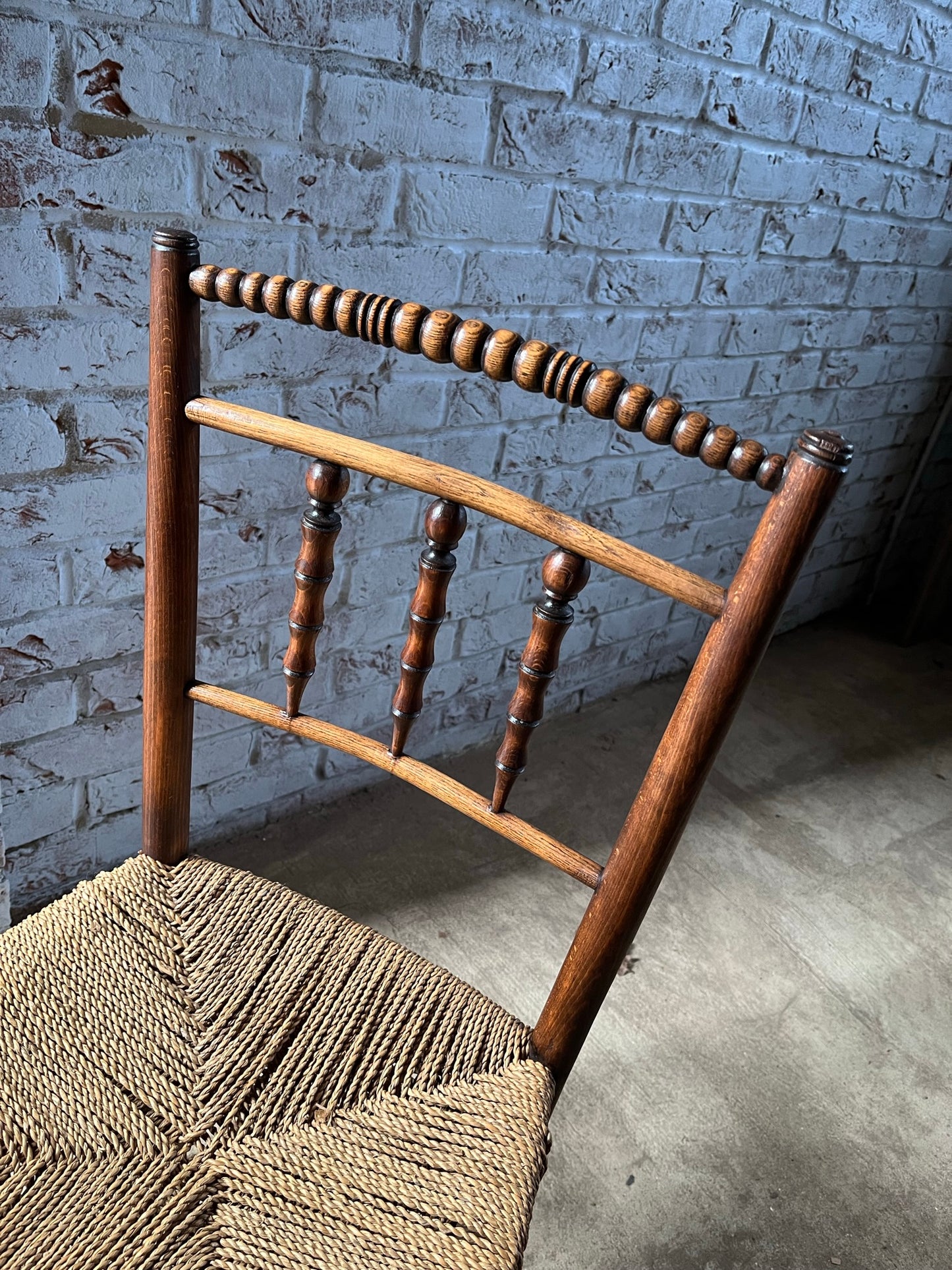 Antique spindle and bobbin back country side chair.