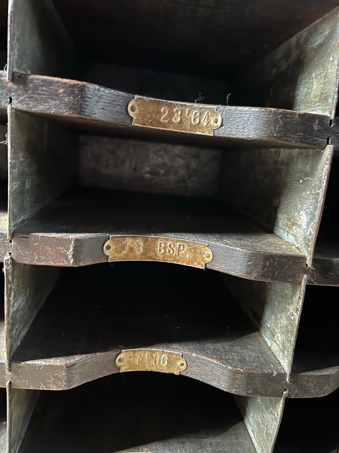A vintage pine and metal industrial pigeon hole cabinet.