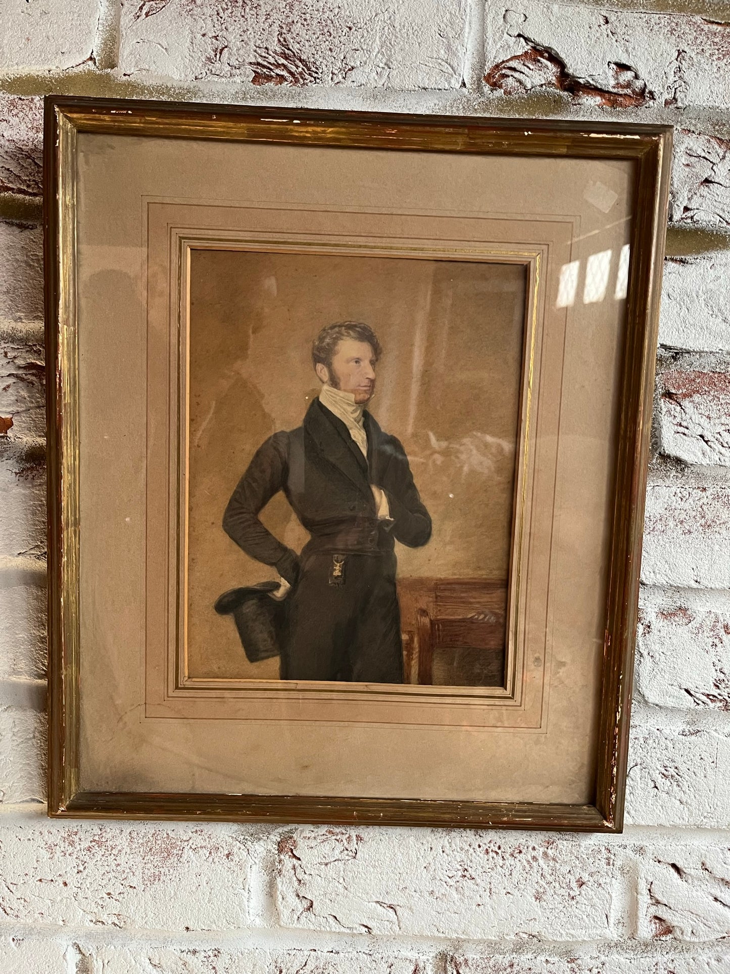 19th century watercolour portrait of a gentleman holding a top hat.