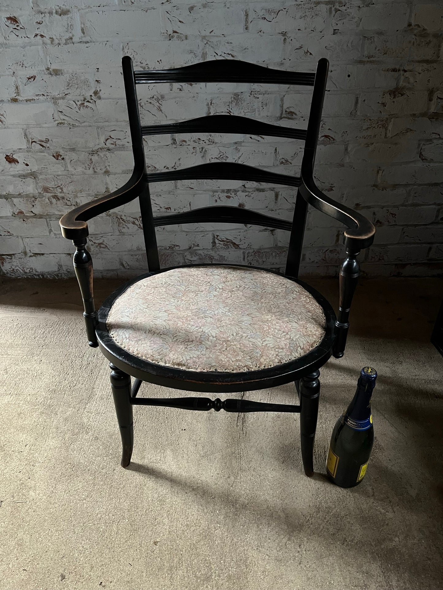 Aesthetic movement low ebonised chair.