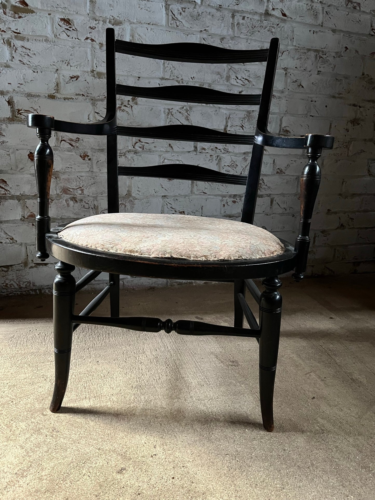 Aesthetic movement low ebonised chair.
