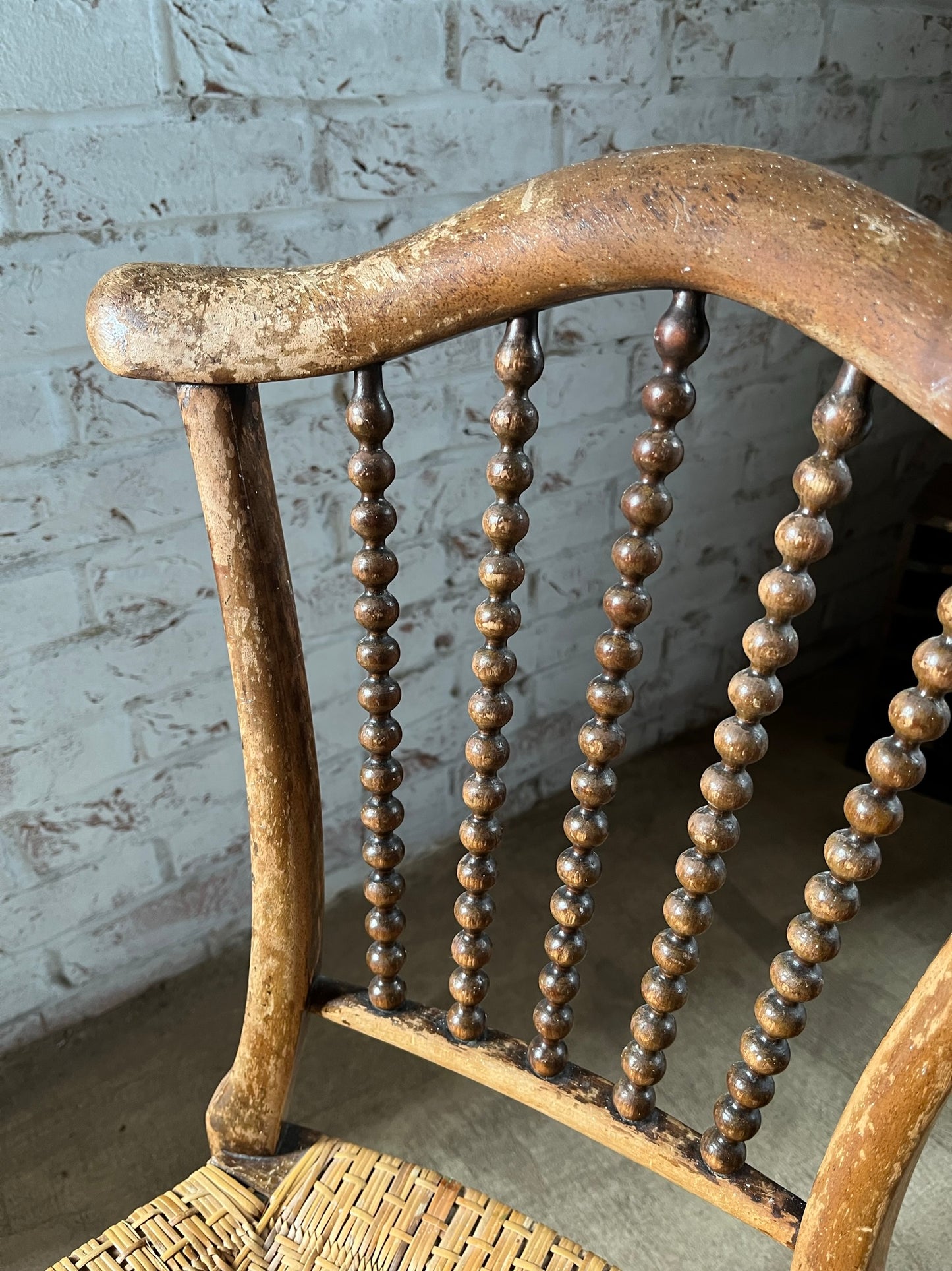 Chair with lyre-shaped back and bobbin back splat.
