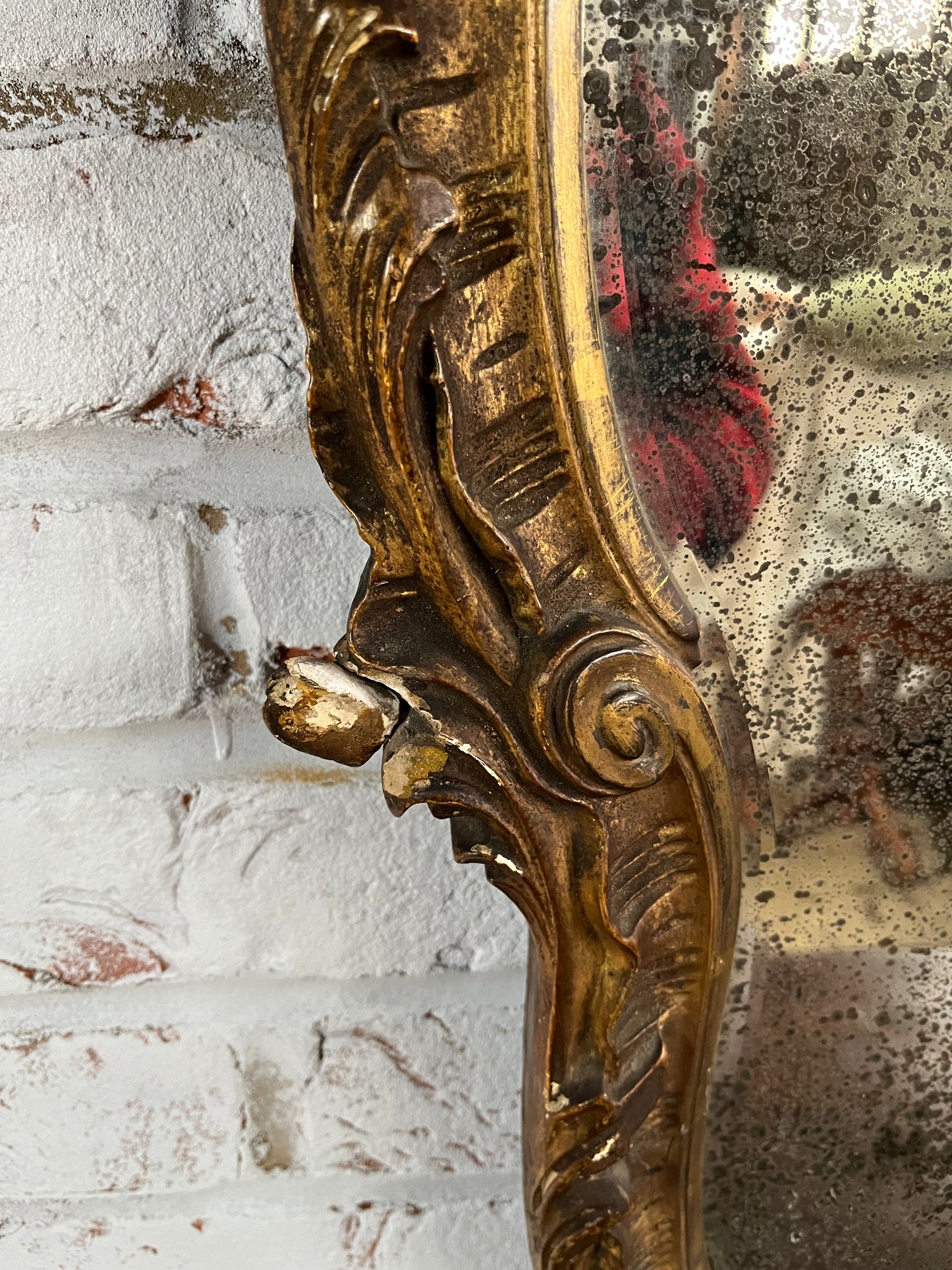 Superb rococo style mirror with foxed plate.