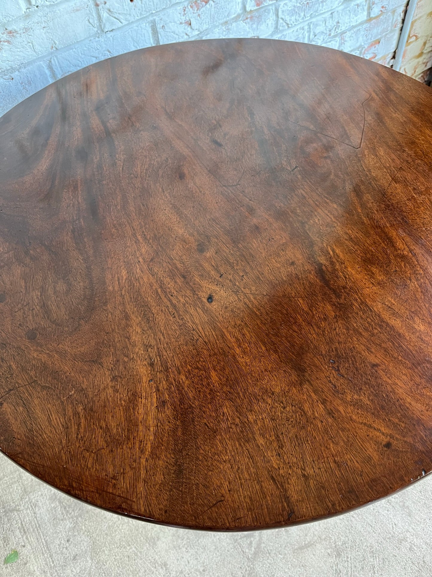 George III mahogany tilt top tripod table.