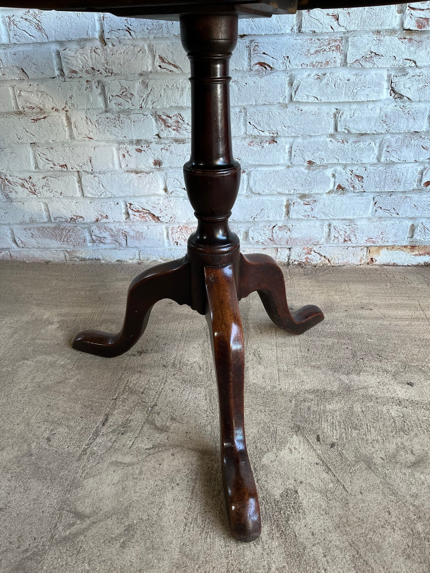 George III mahogany tilt top tripod table.