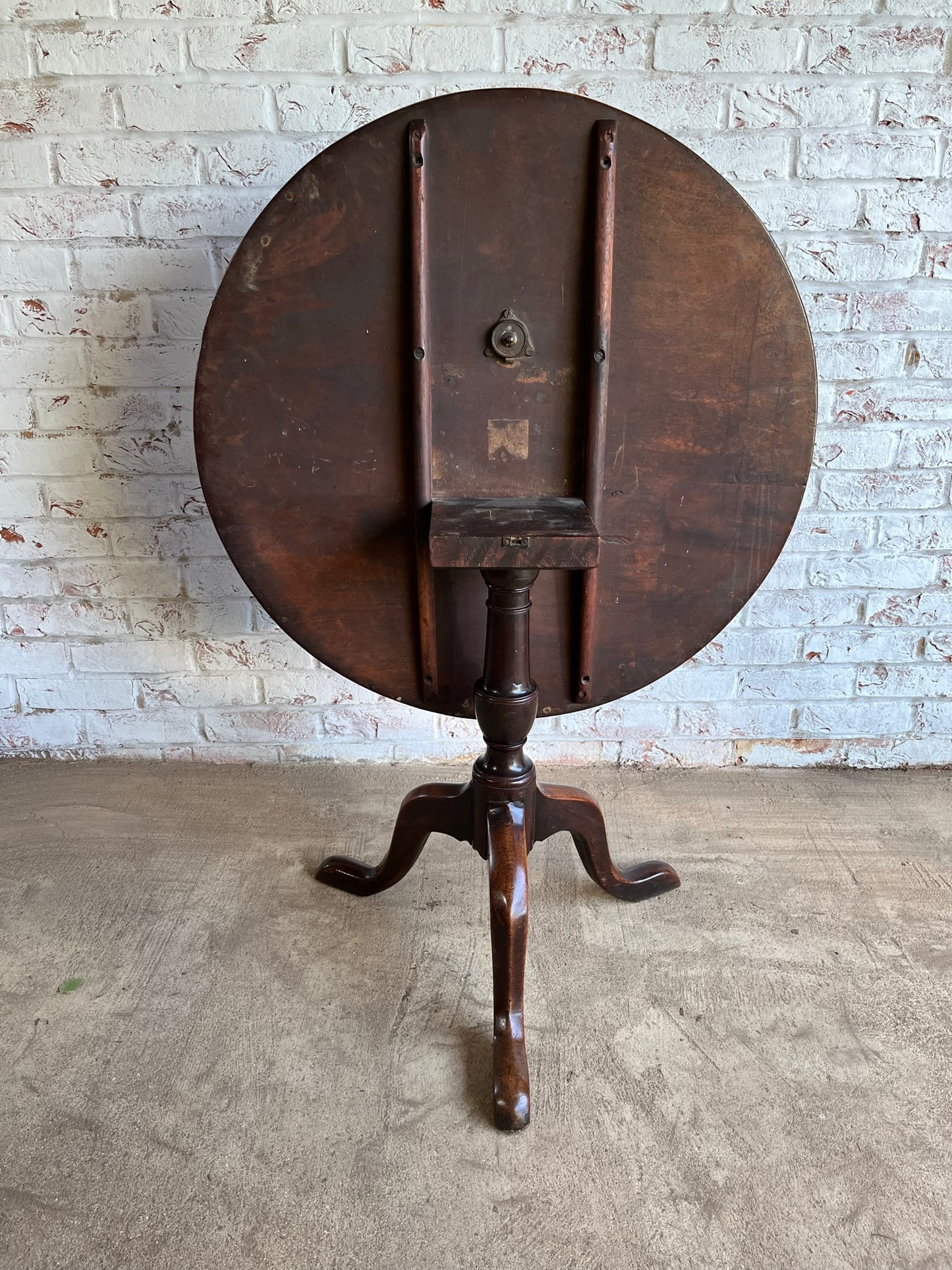 George III mahogany tilt top tripod table.