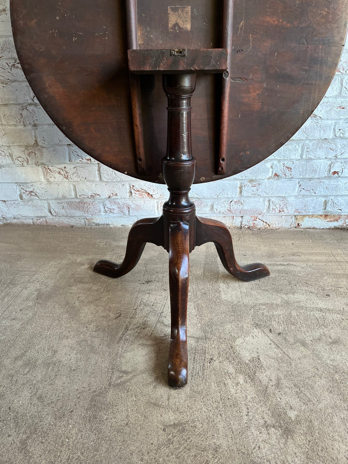 George III mahogany tilt top tripod table.
