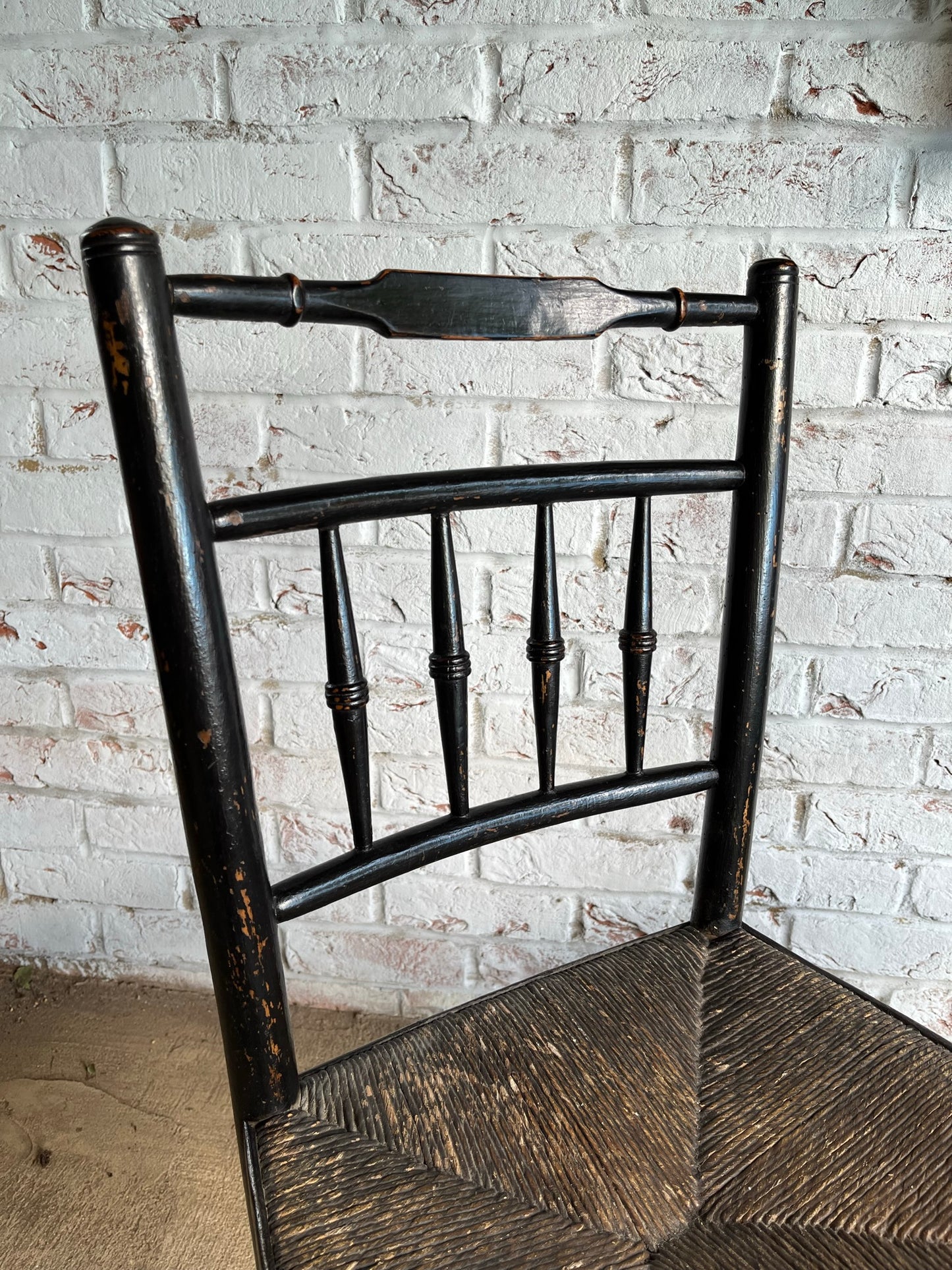 19th century pair of ebonised spindle back chairs.