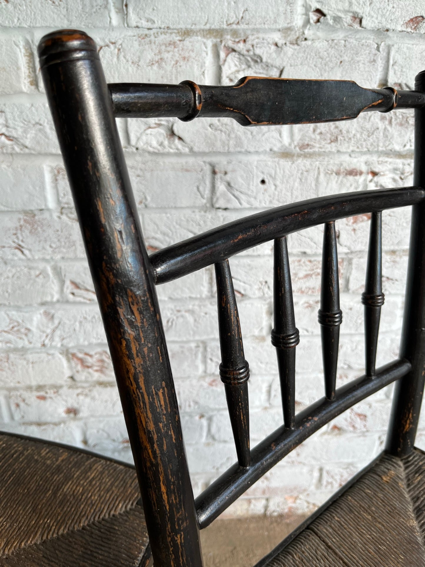 19th century pair of ebonised spindle back chairs.