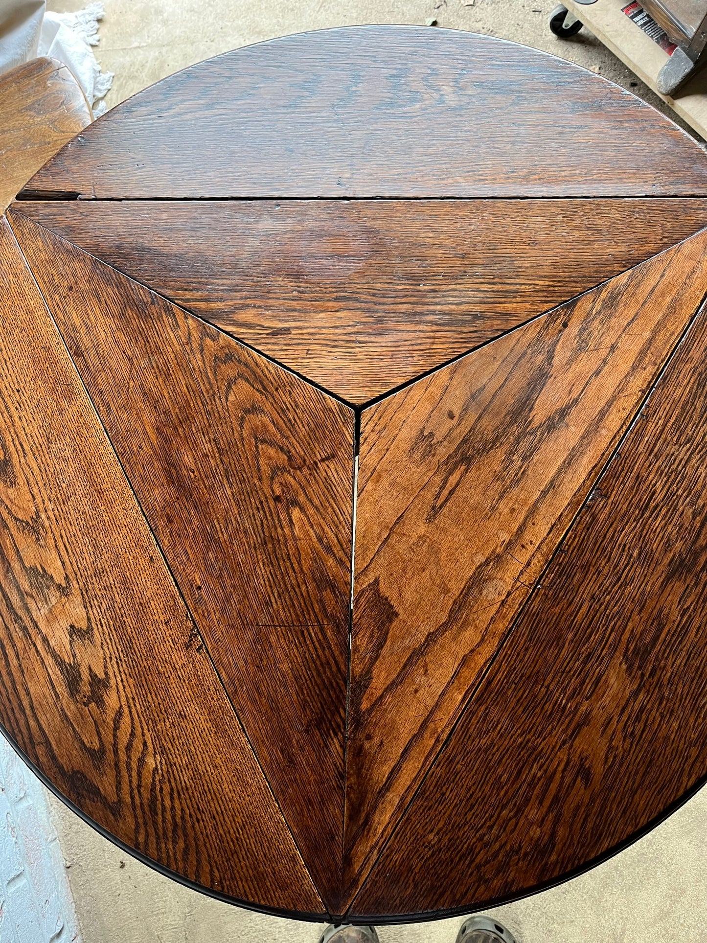Late 19th/early 20th century oak cricket table with drop flap top.
