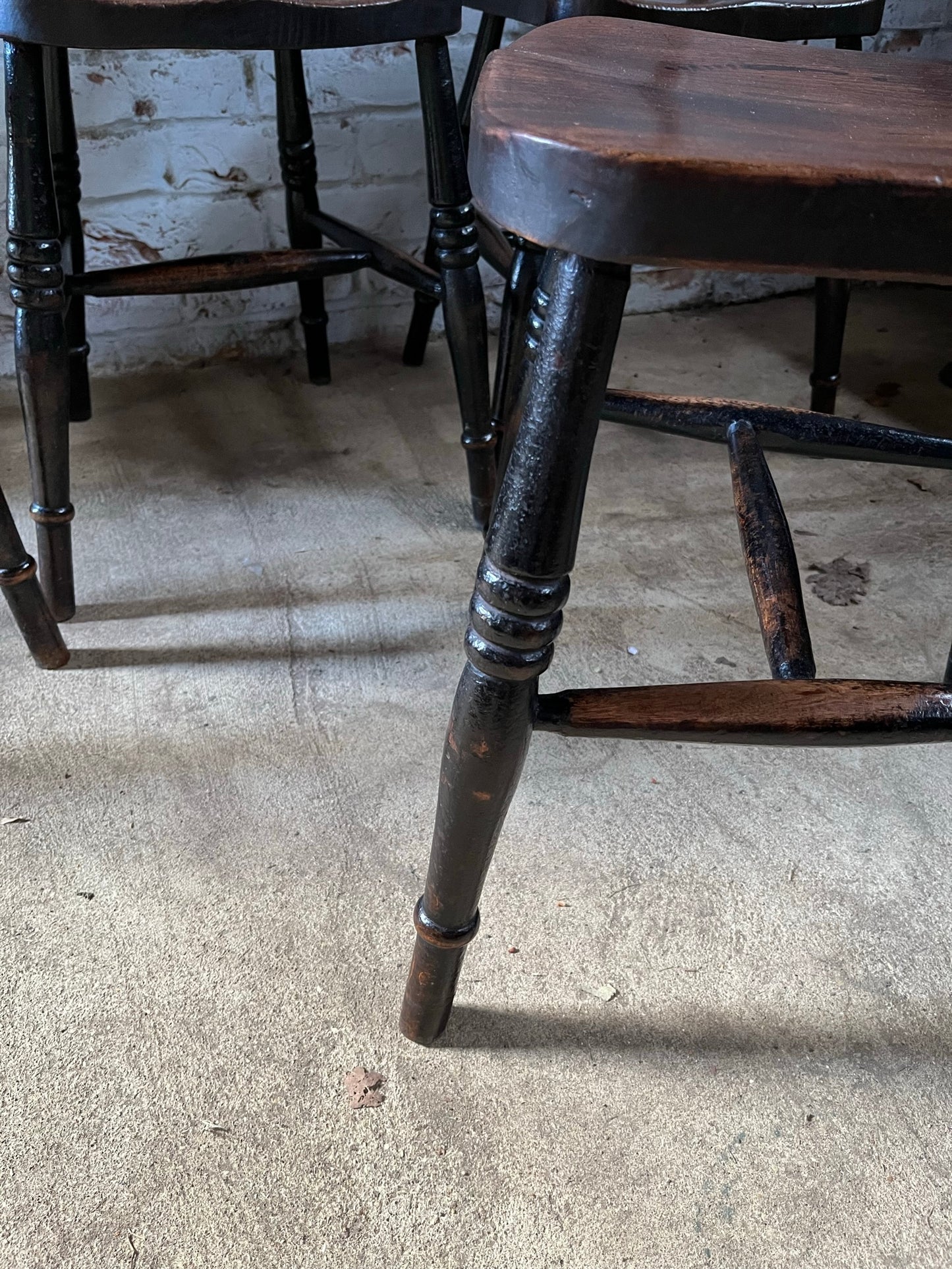 Good set of four C19th stamped kitchen chairs.